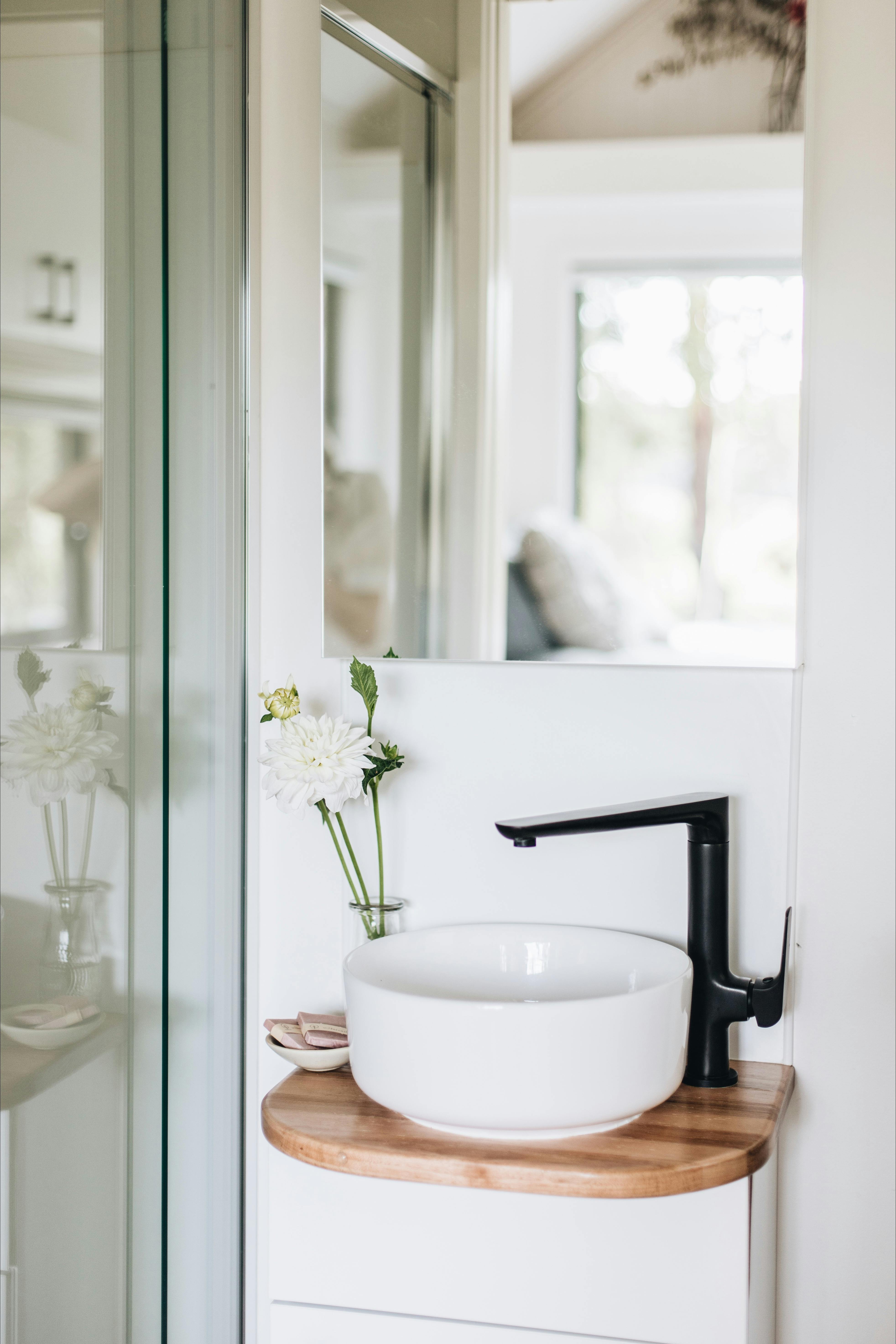 Modern bathroom with hot shower and flushing toilet