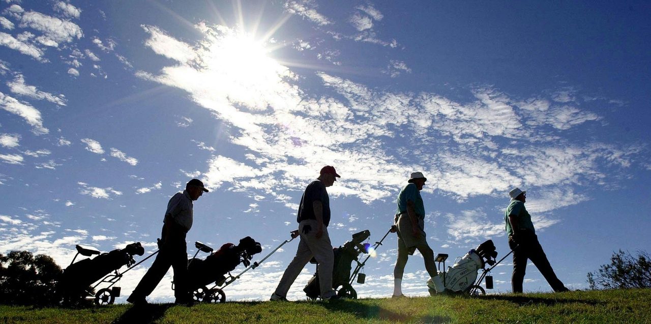 Golfers in the Sun
