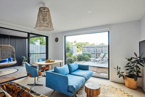 Living room with a blue couch.