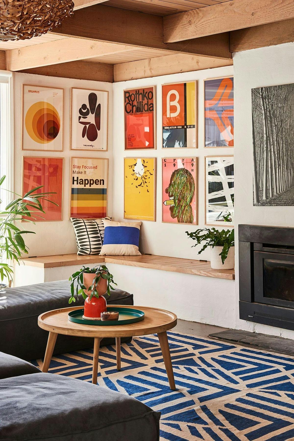 Living room with colourful paintings on the wall.