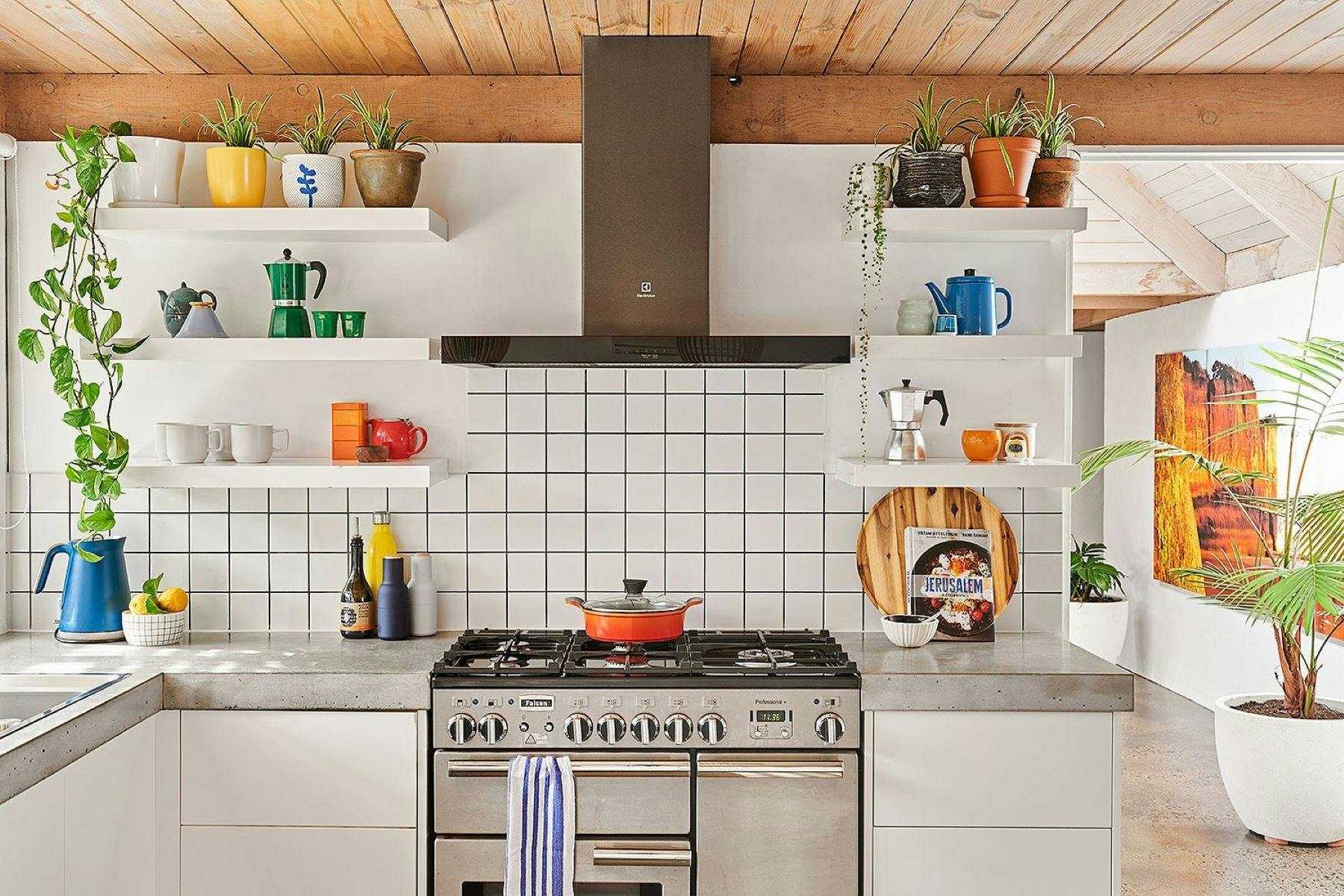 White kitchen with colourful decor.