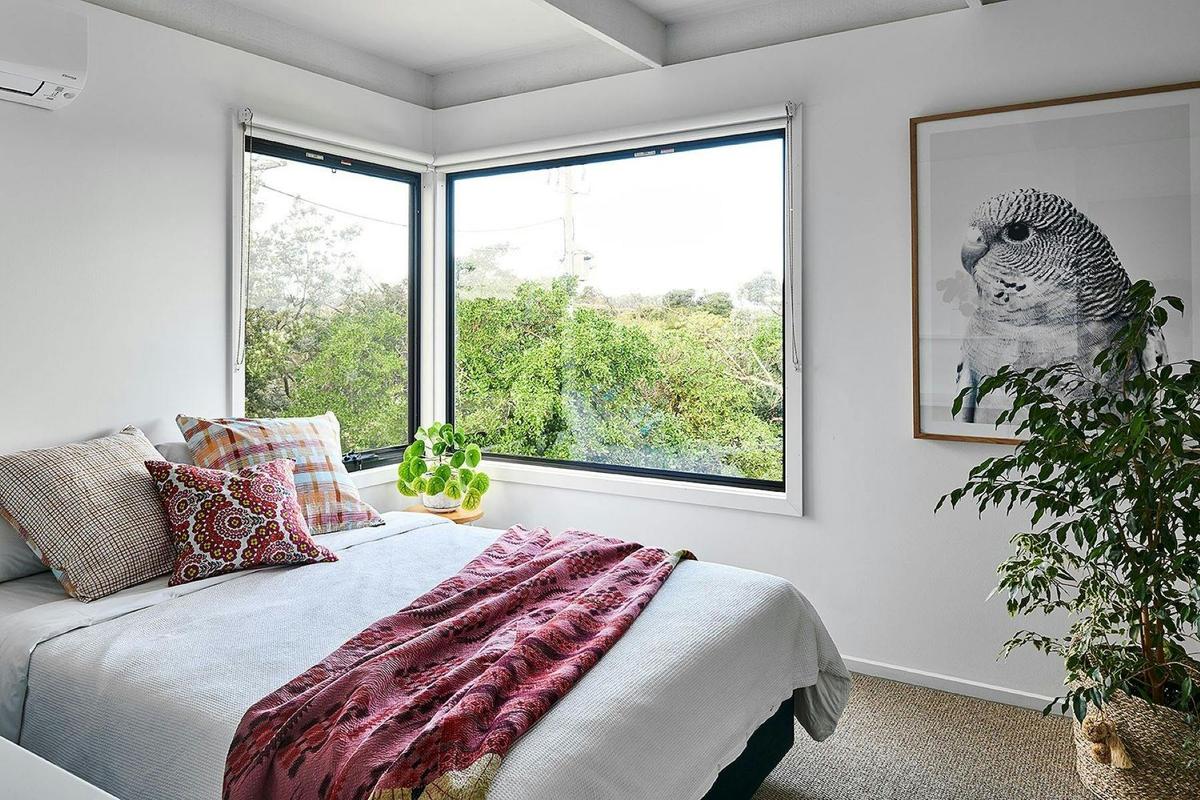 Bedroom with pink blanket