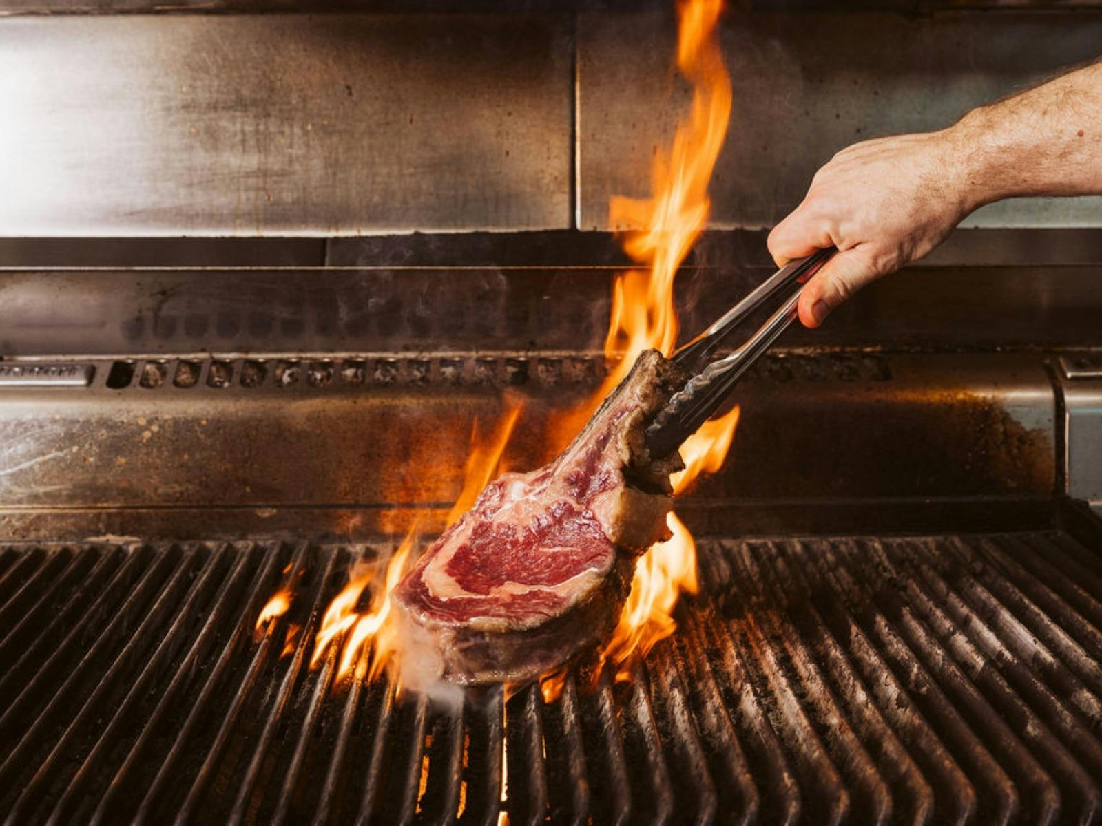 Restaurant 1309 beef on the grill with flames