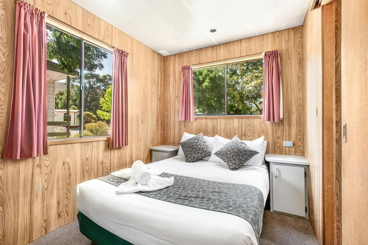 Main bedroom in the two-bedroom family budget cabin