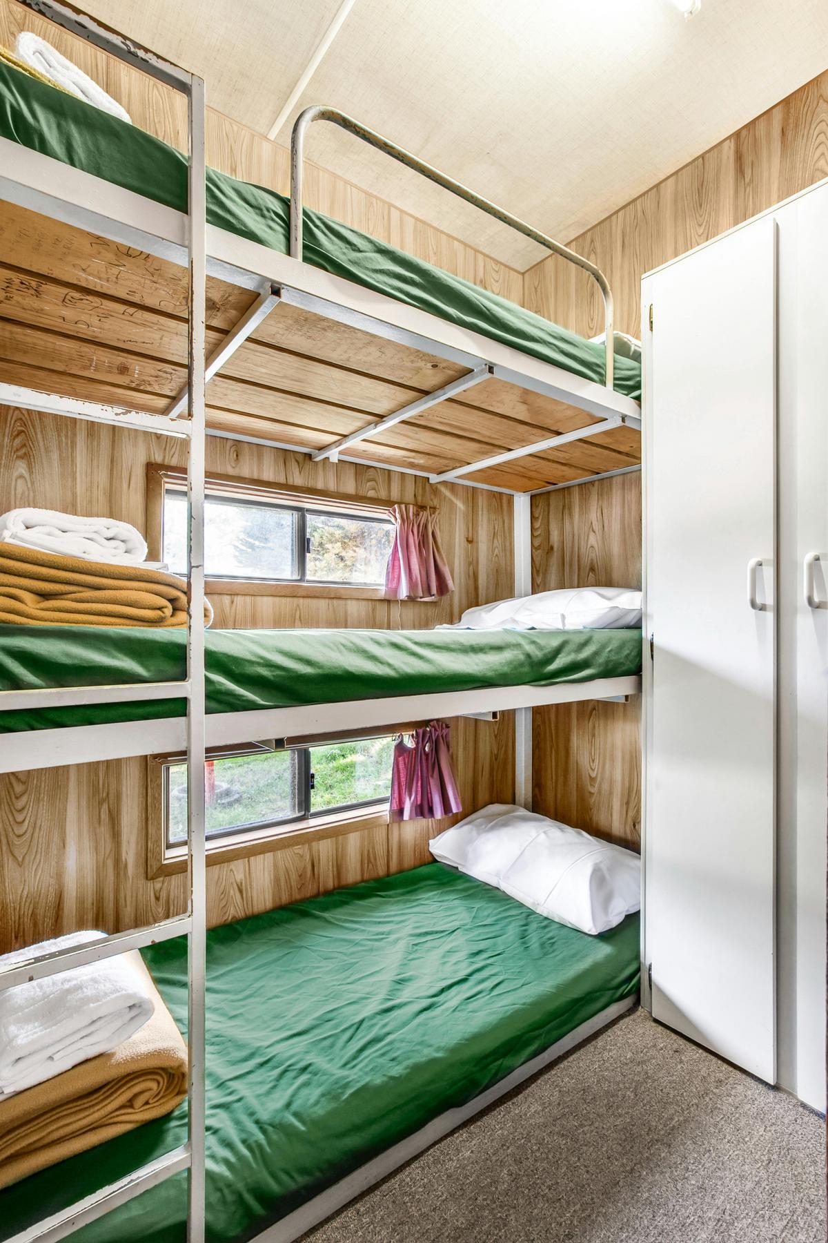 triple bunk in the two-bedroom family budget cabin