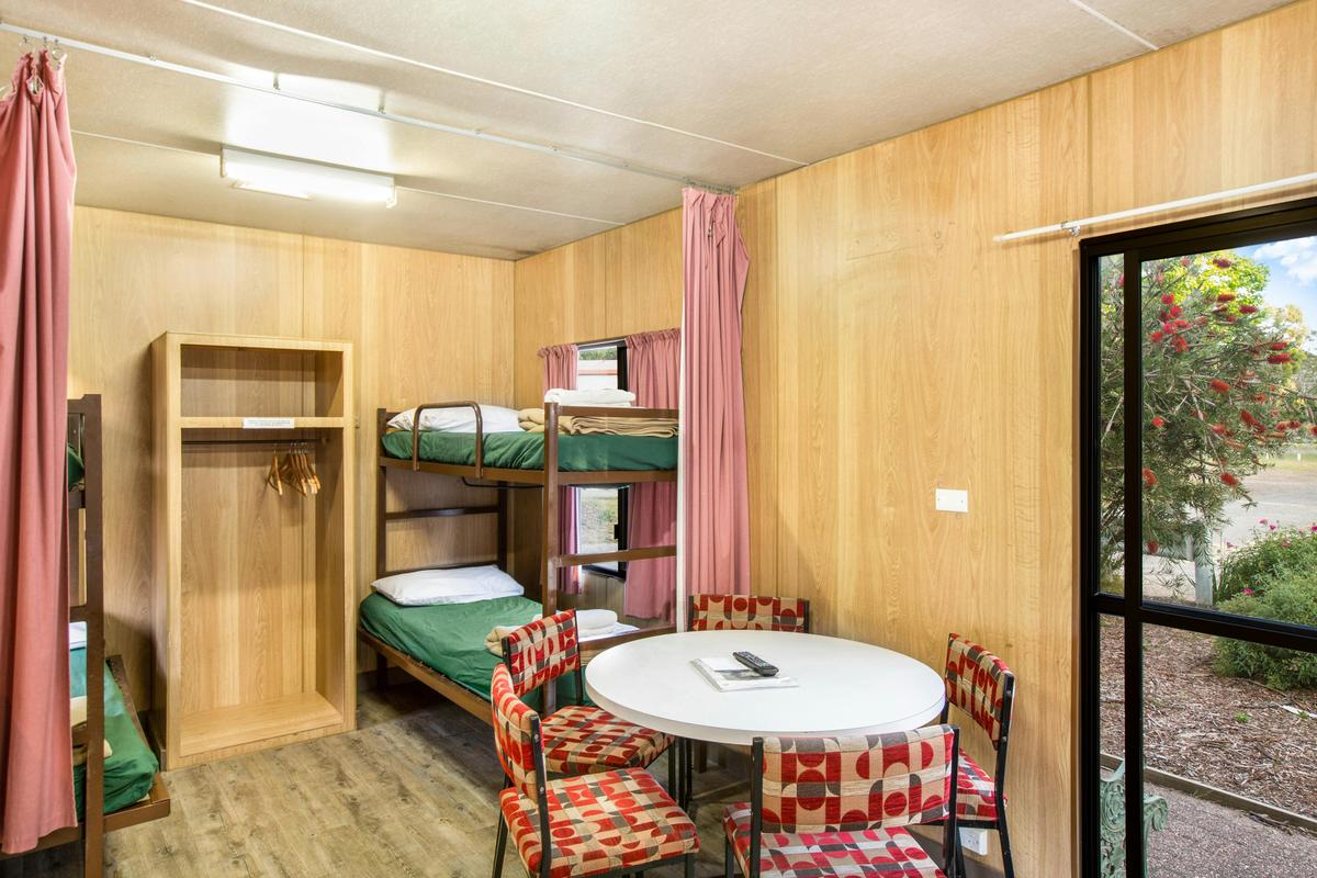 Bunk beds and dining area in the Budget Cabin