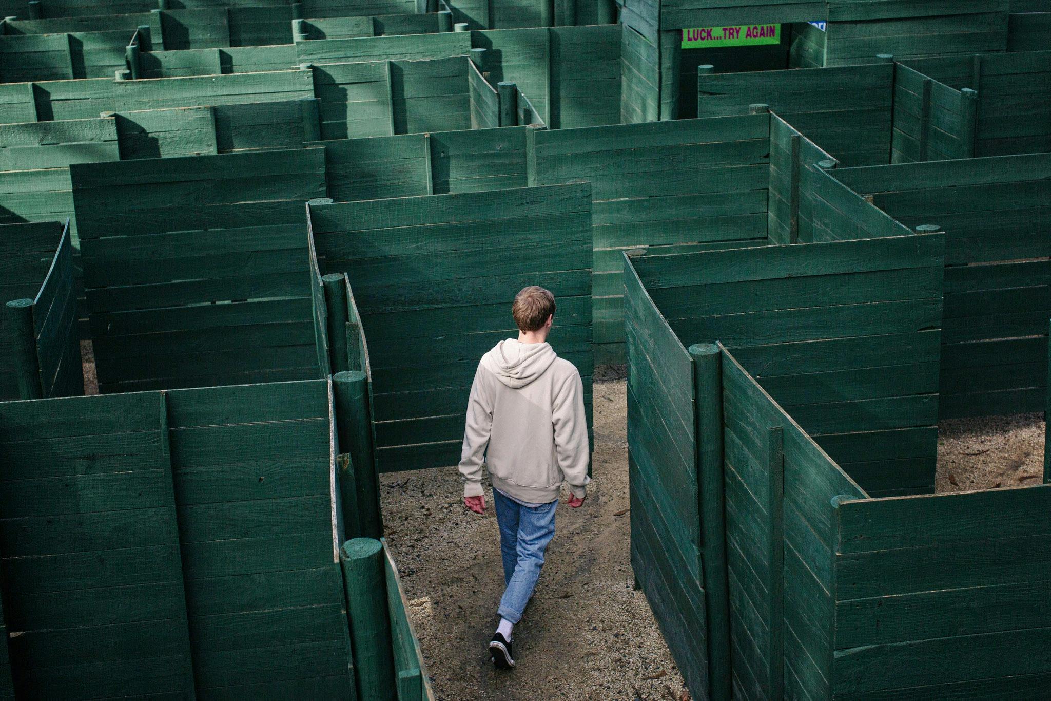 Guest finding their way through the giant maze at A Maze'N Things