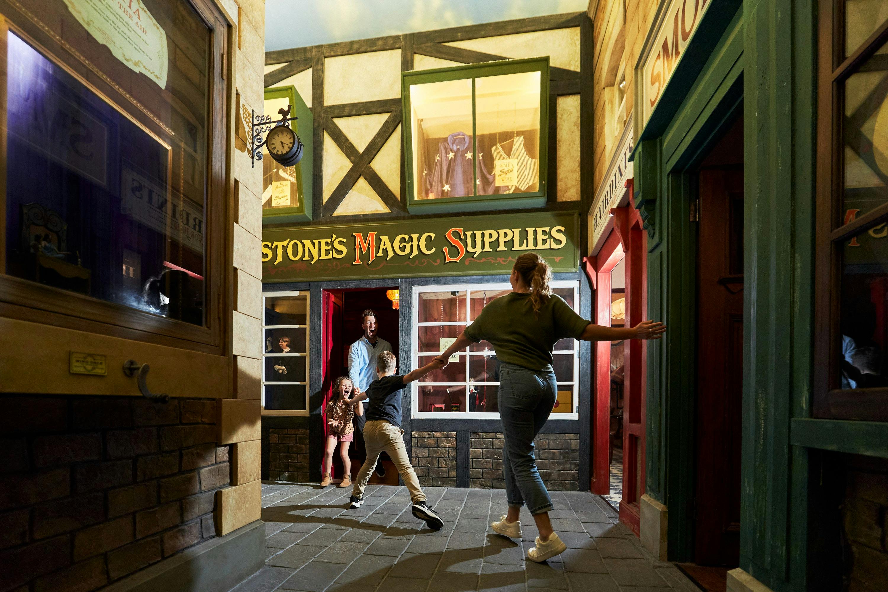 Family exploring Magic Manor at A Maze'N Things