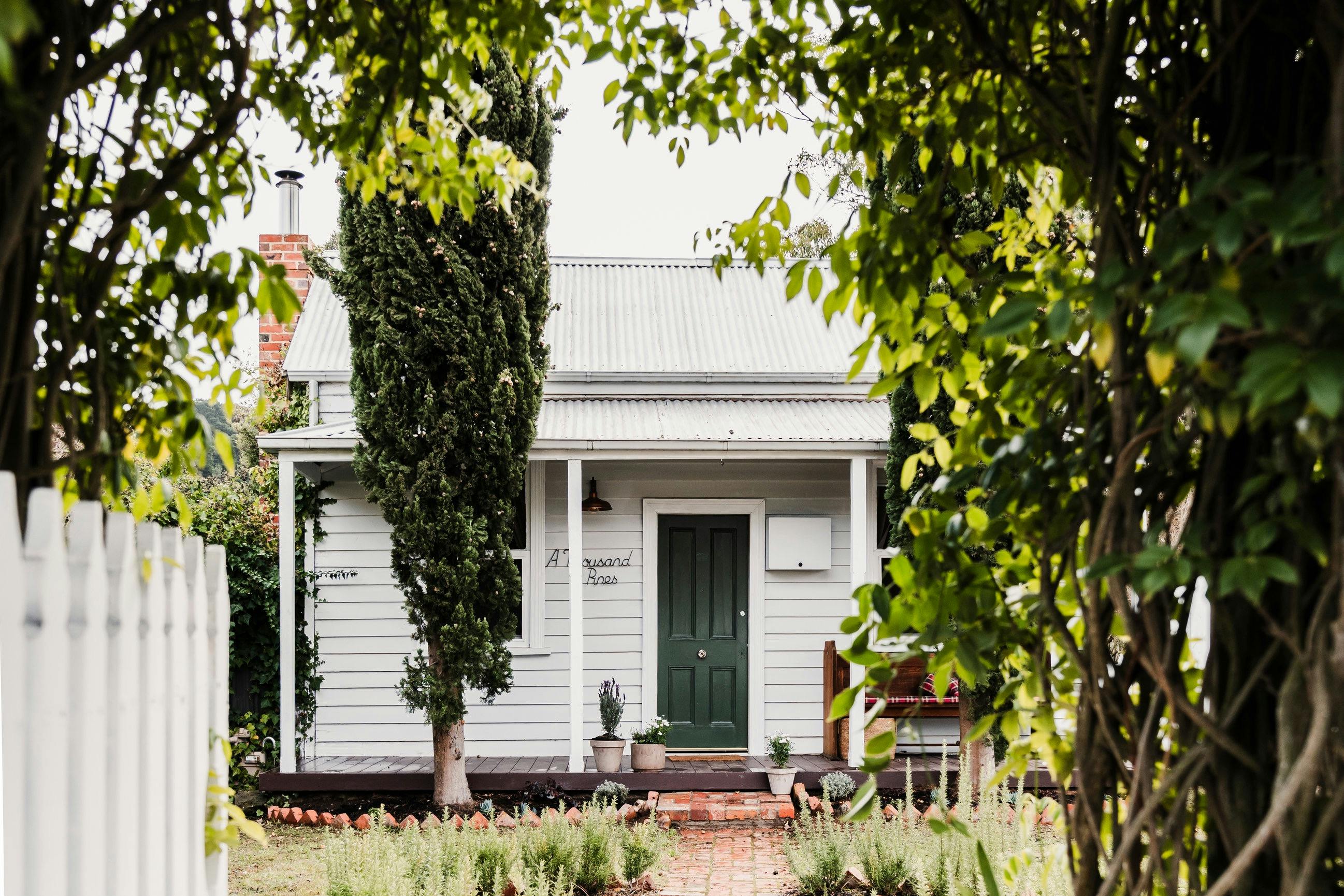 Front view of cottage standing at the gate