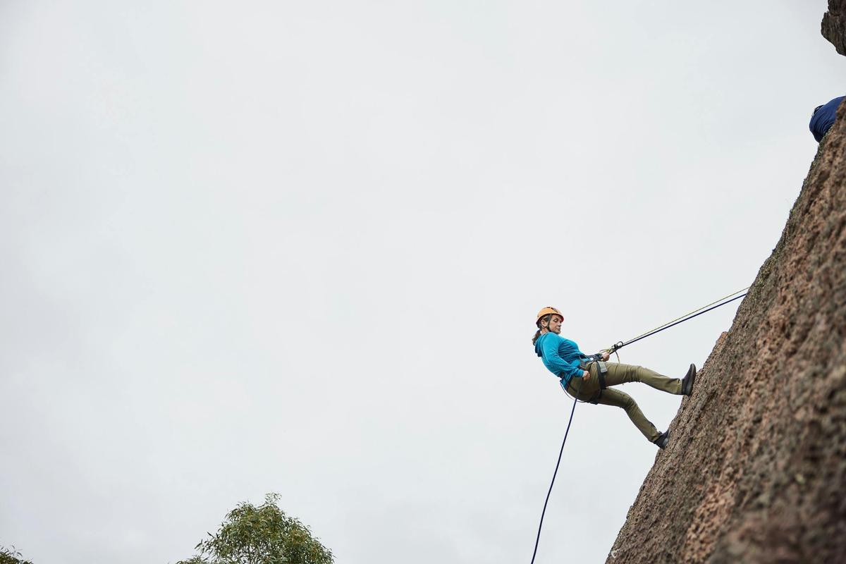 Abseiling down a cliff