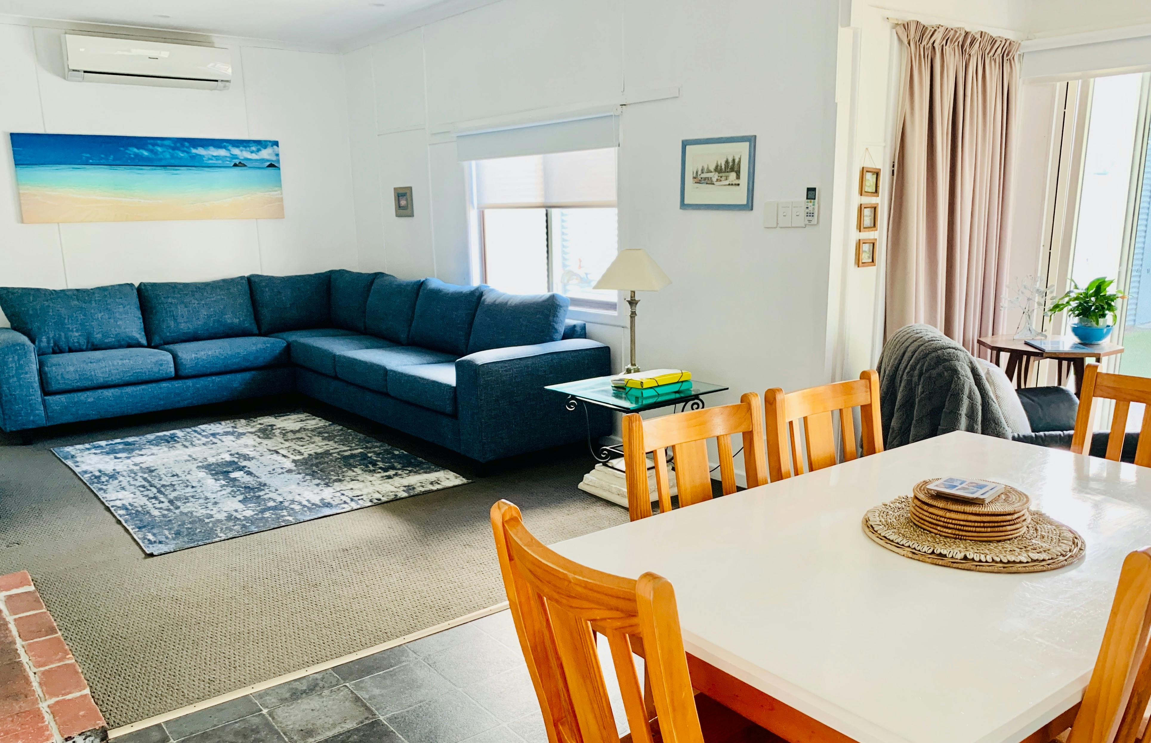 Living room with couch, table and chairs