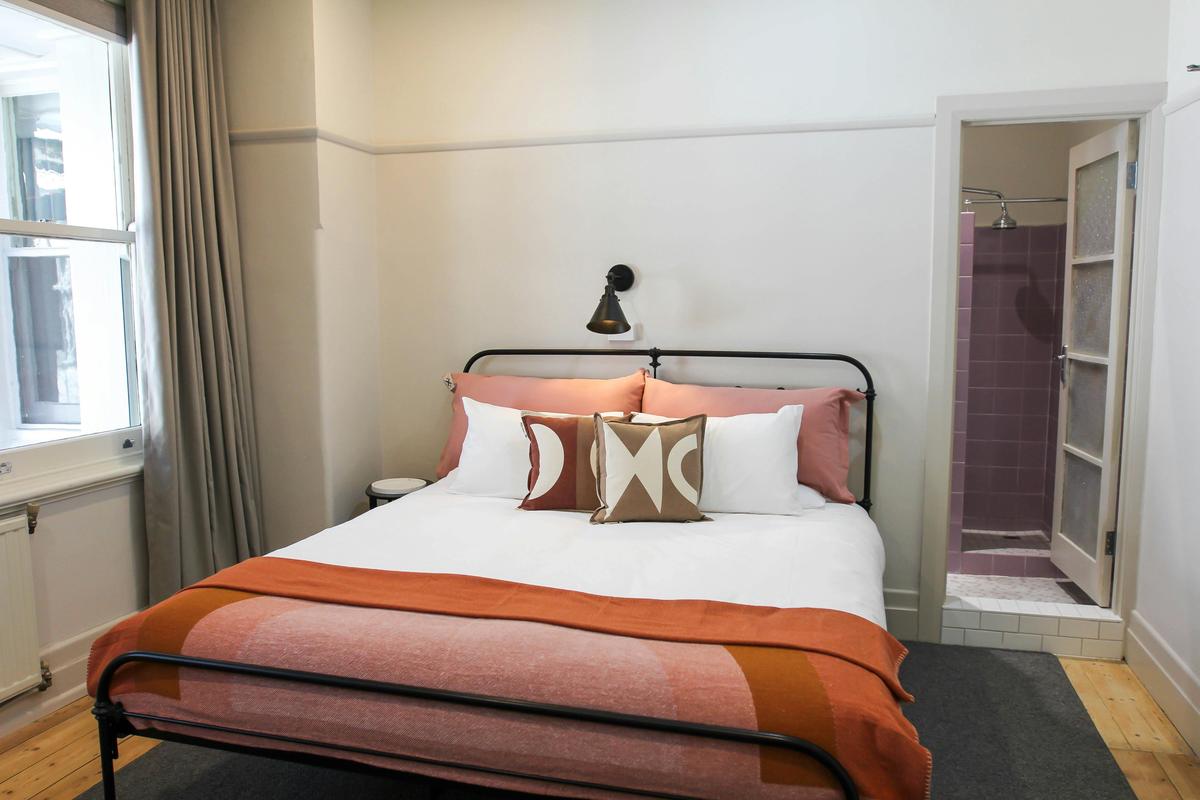 Room 4 with vintage ensuite with an internal view of the Hotel Atrium