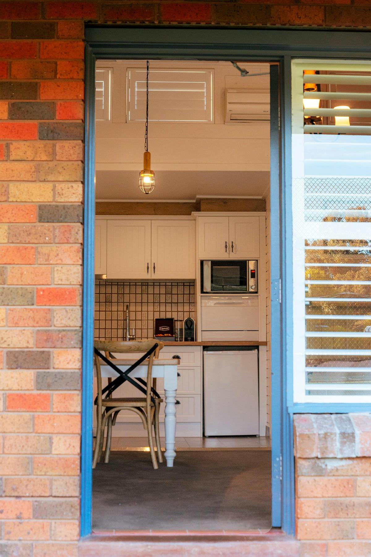 Open door revealing studio apartment at Alzburg Resort