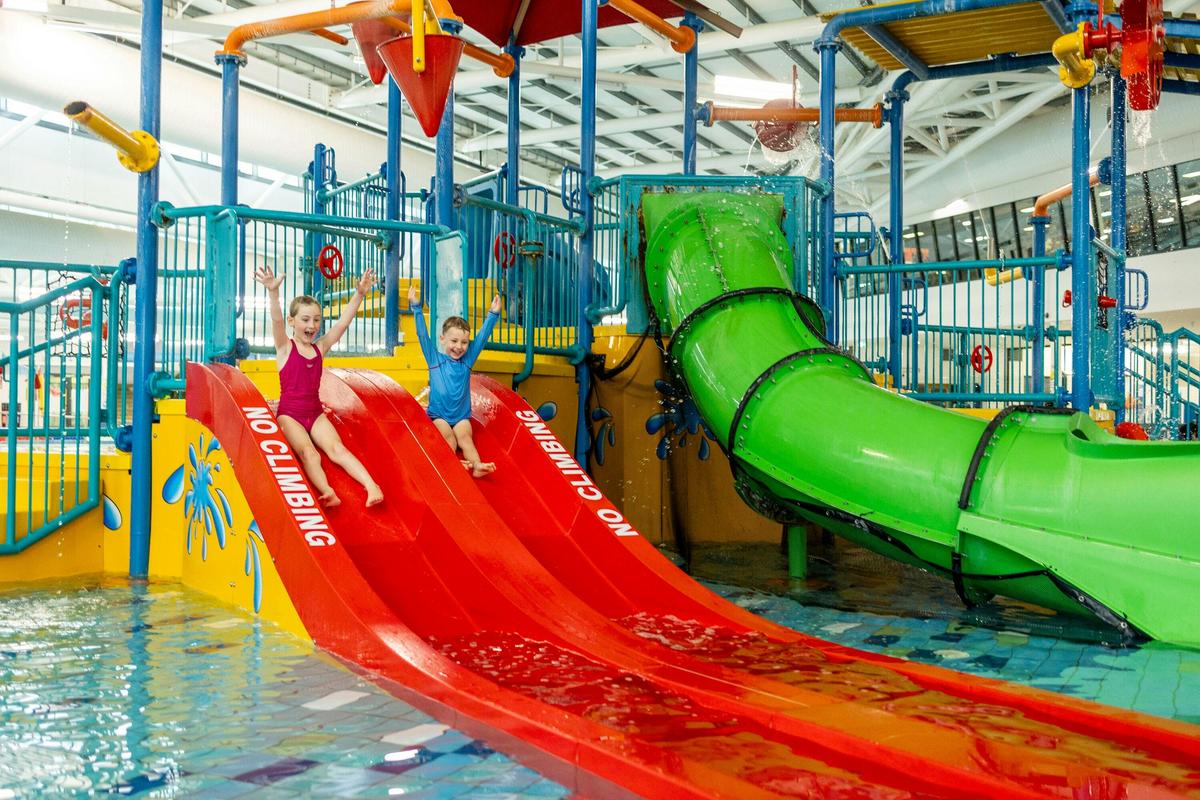 Kids going down water slide