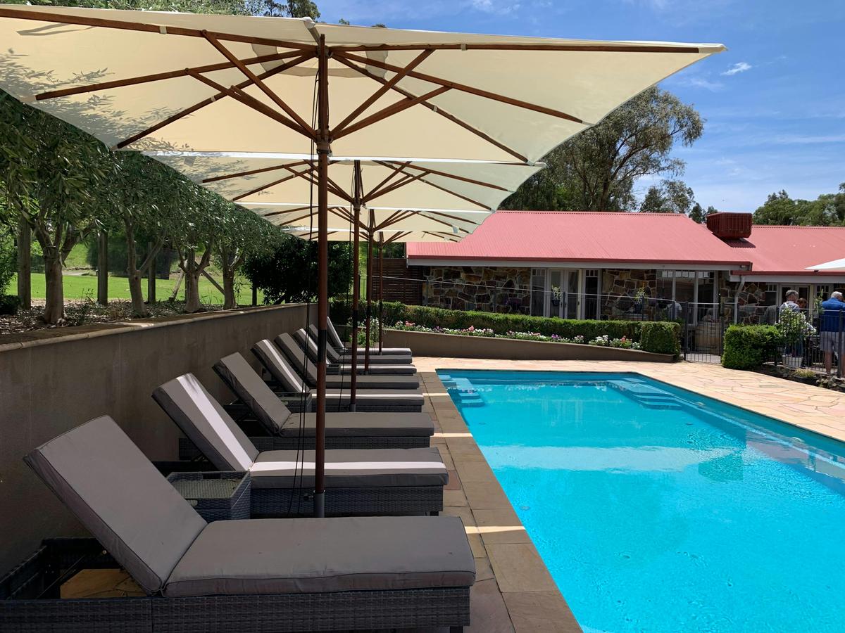 Property outdoor solar heated swimming pool