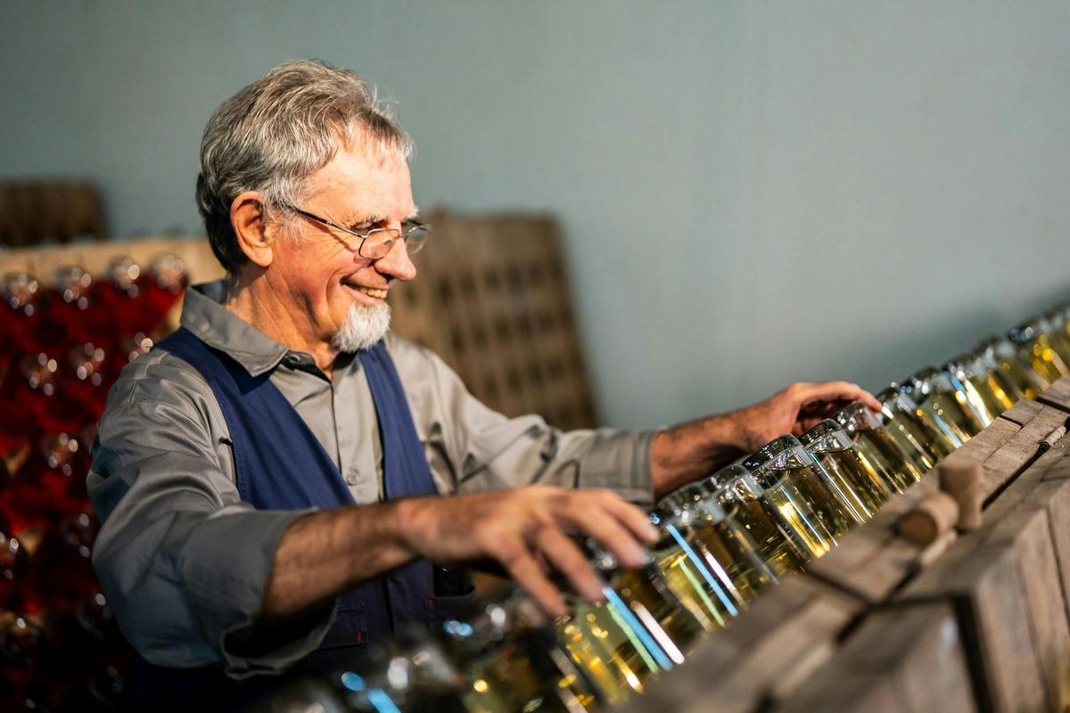 Howard Anderson riddling bottles of sparkling wine