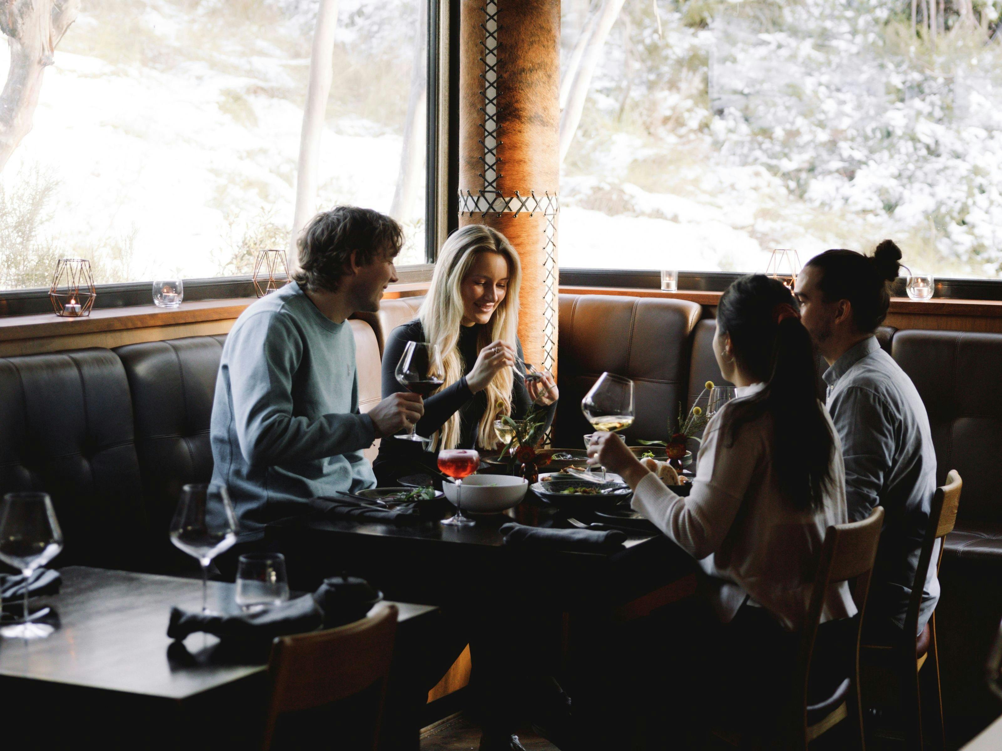 An image of a group of four friends dining at Astra Bar & Restaurant