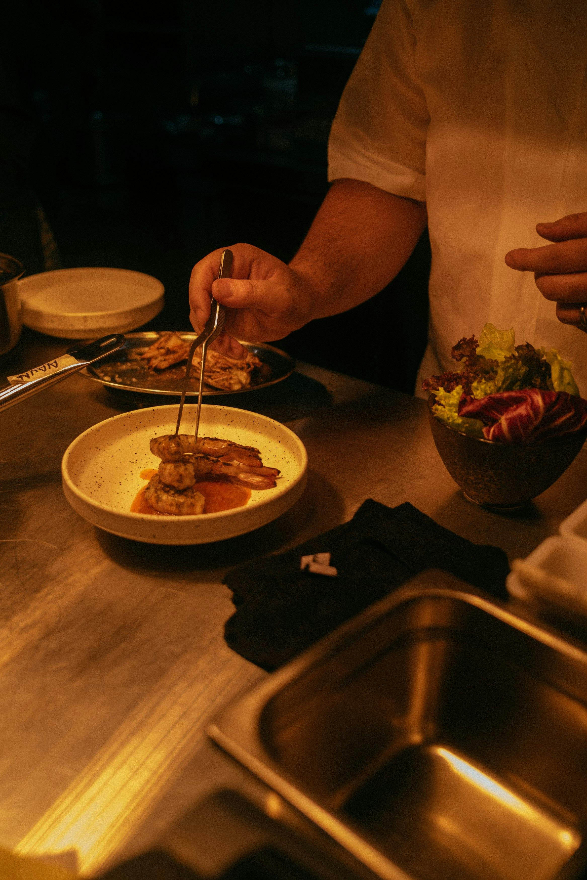 Chef plating a dish