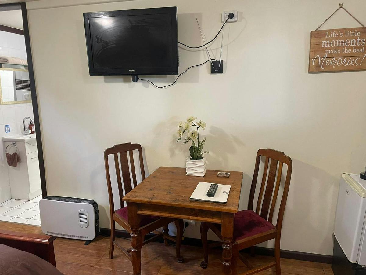 Apartment Sitting Area With Flat Screen TV