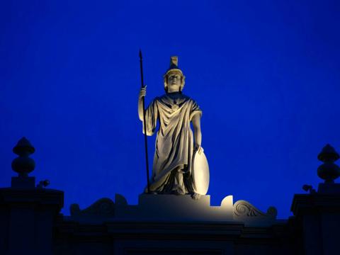 Minerva statue at top of building