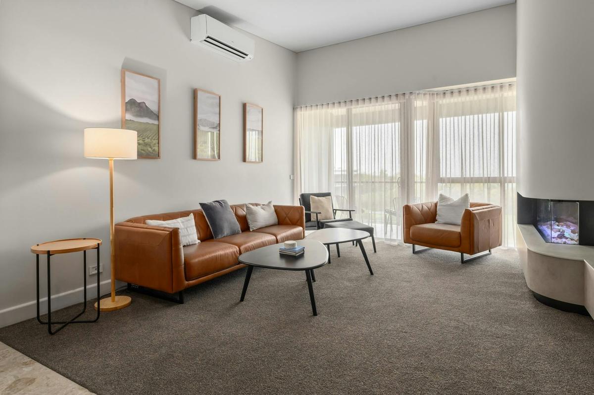 The Director's Suite Lounge, Fireplace, & Balcony View