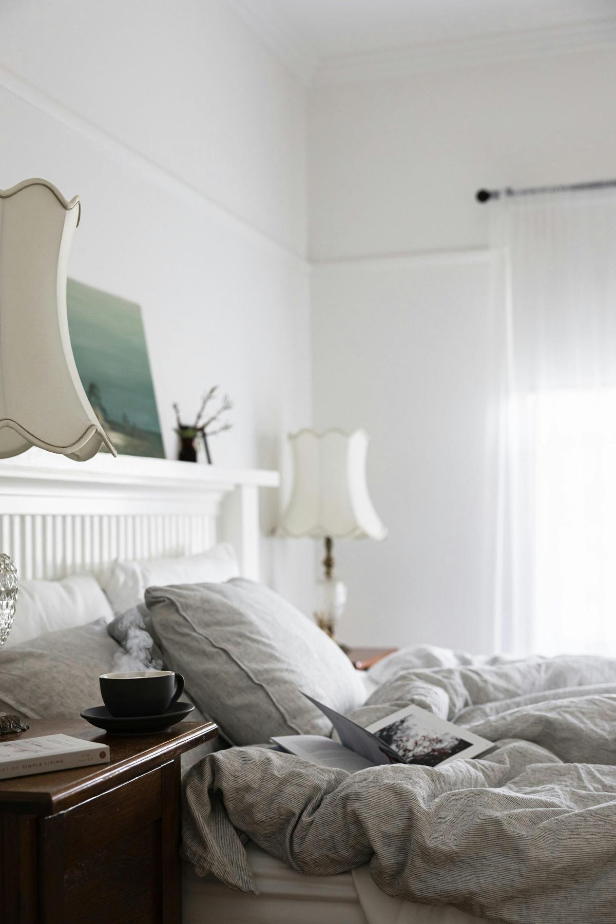 The beauty of our king room. Cozy bedding, soft dappled light and lots of reasons to sleep in