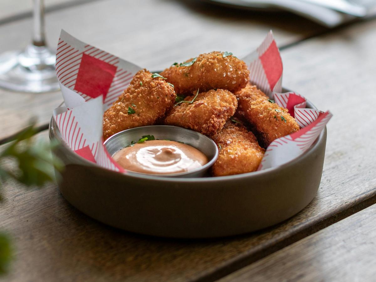 Prosciutto and smoked mozzarella croquette with smoked aioli