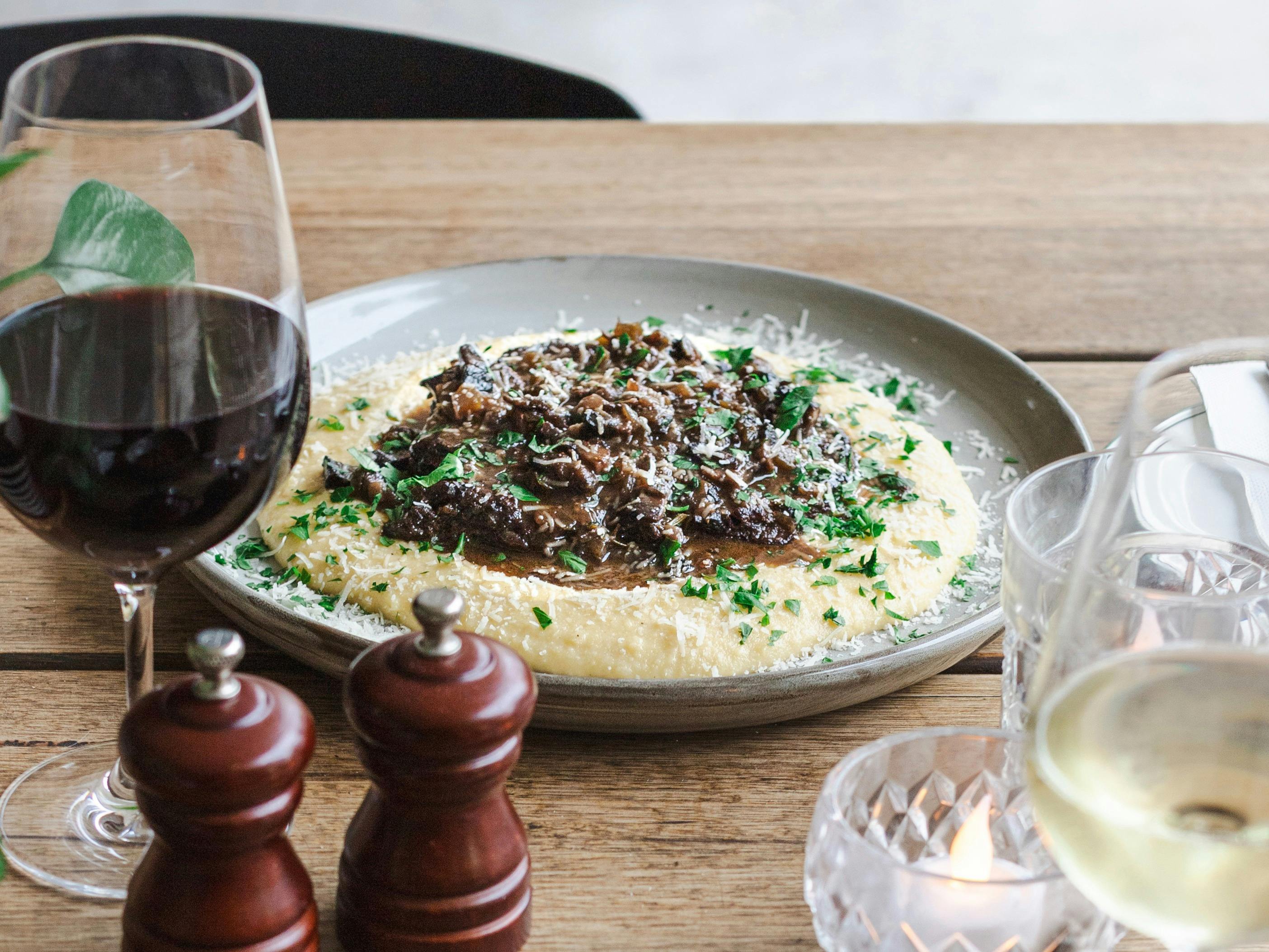 Braised Beef and Mushroom in a red wine sauce with mushrooms and Parmesan, on soft polenta
