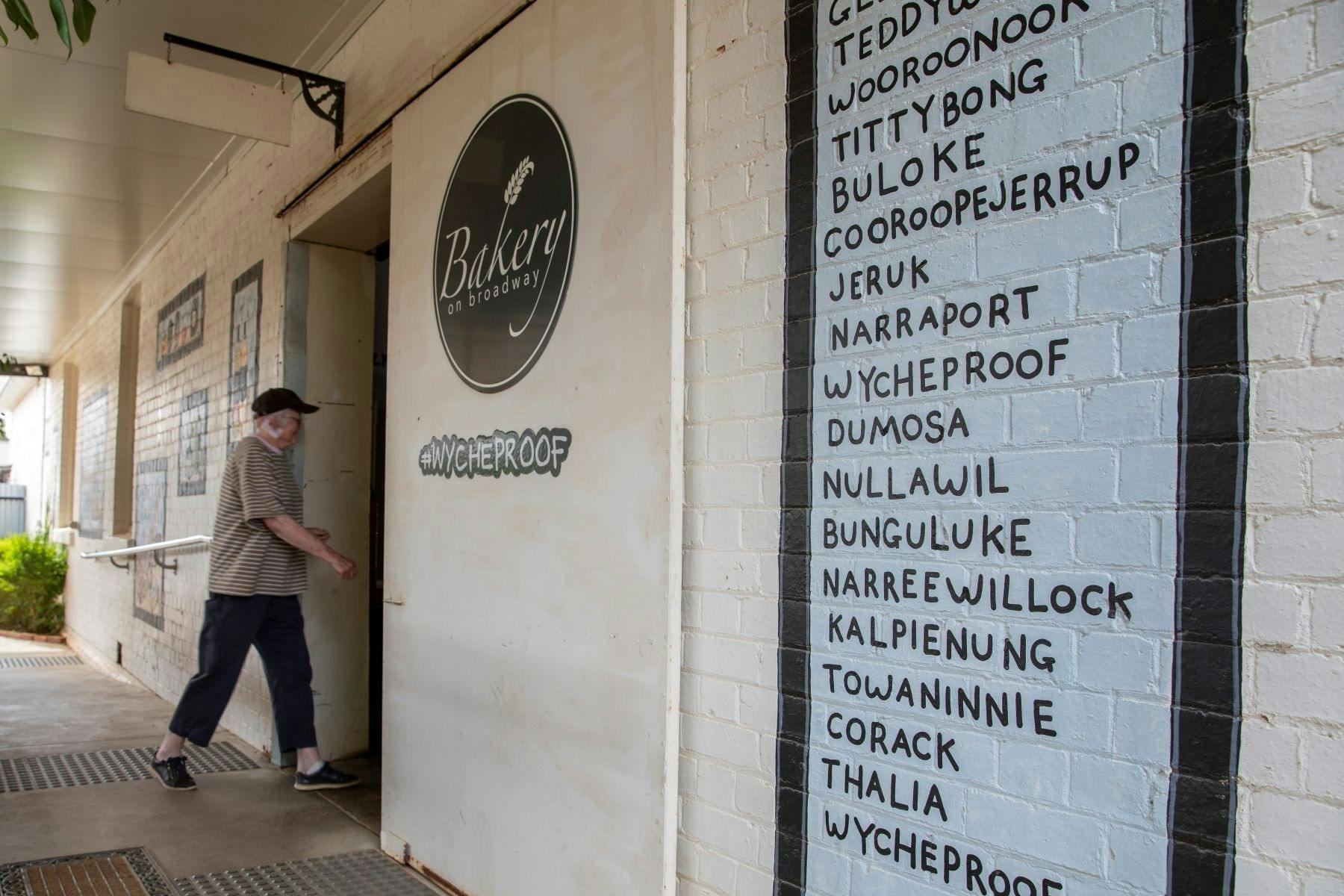 Person walking in the front door of the bakery