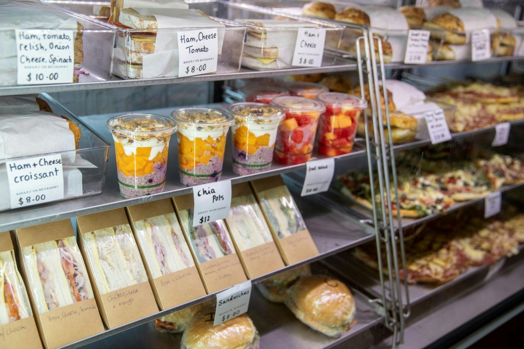 Refrigerated cabinet of sandwiches and treats at a Bakery