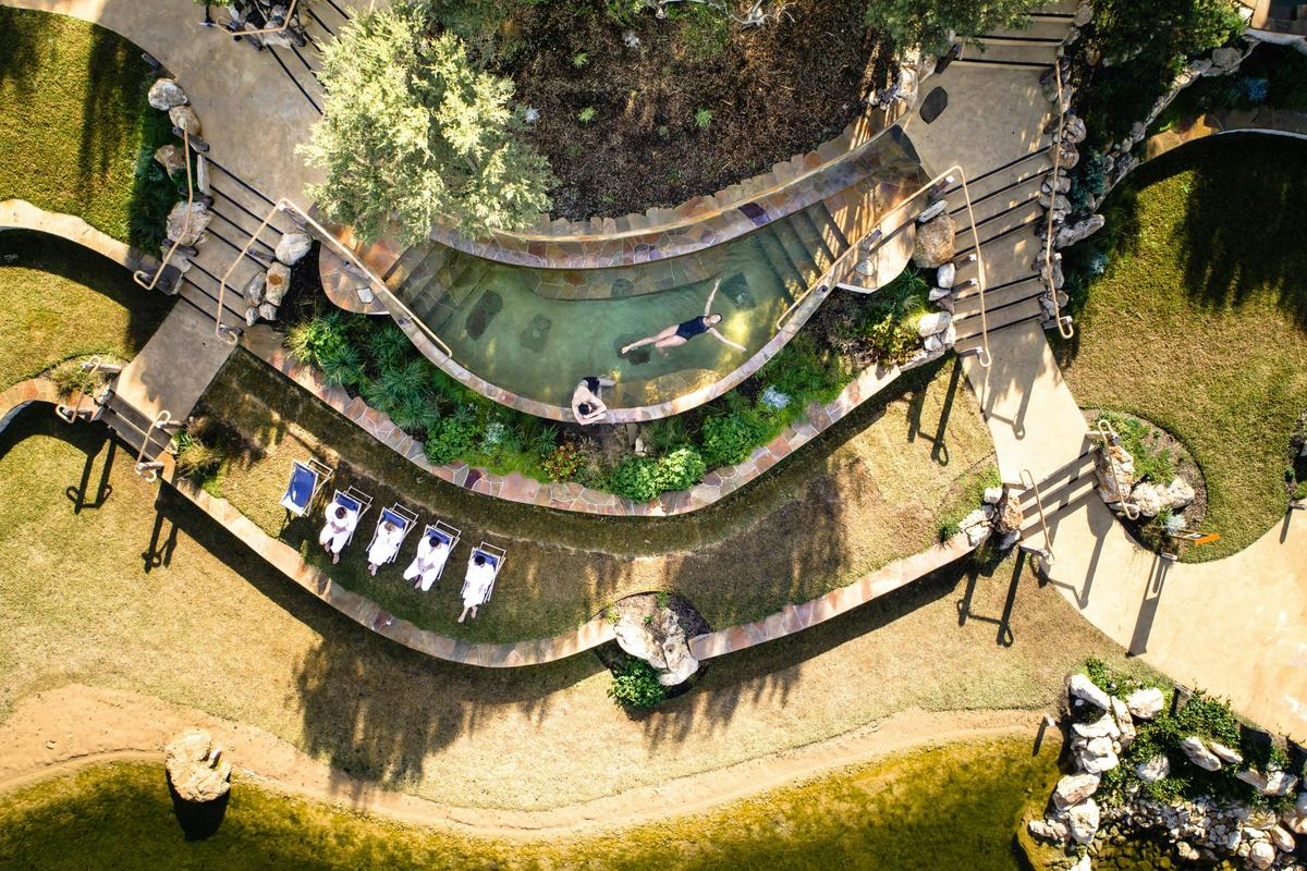 Bath House Amphitheatre - Drone of guest lying in pool