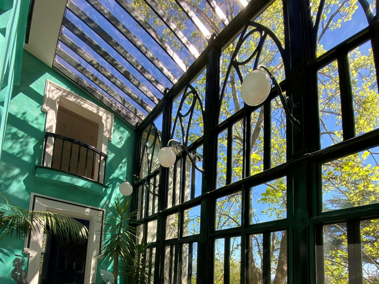 High sunlit atrium at Bad Habits Café in Daylesford