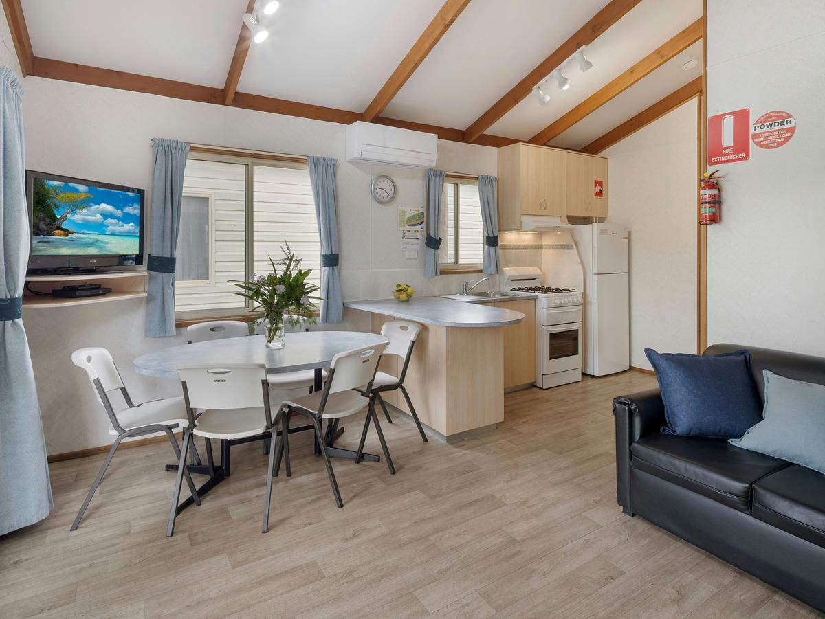 3 Bedroom Villa Interior dining area, kitchen and television