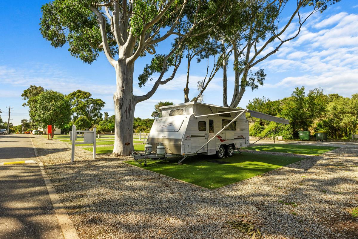 Powered site with caravan