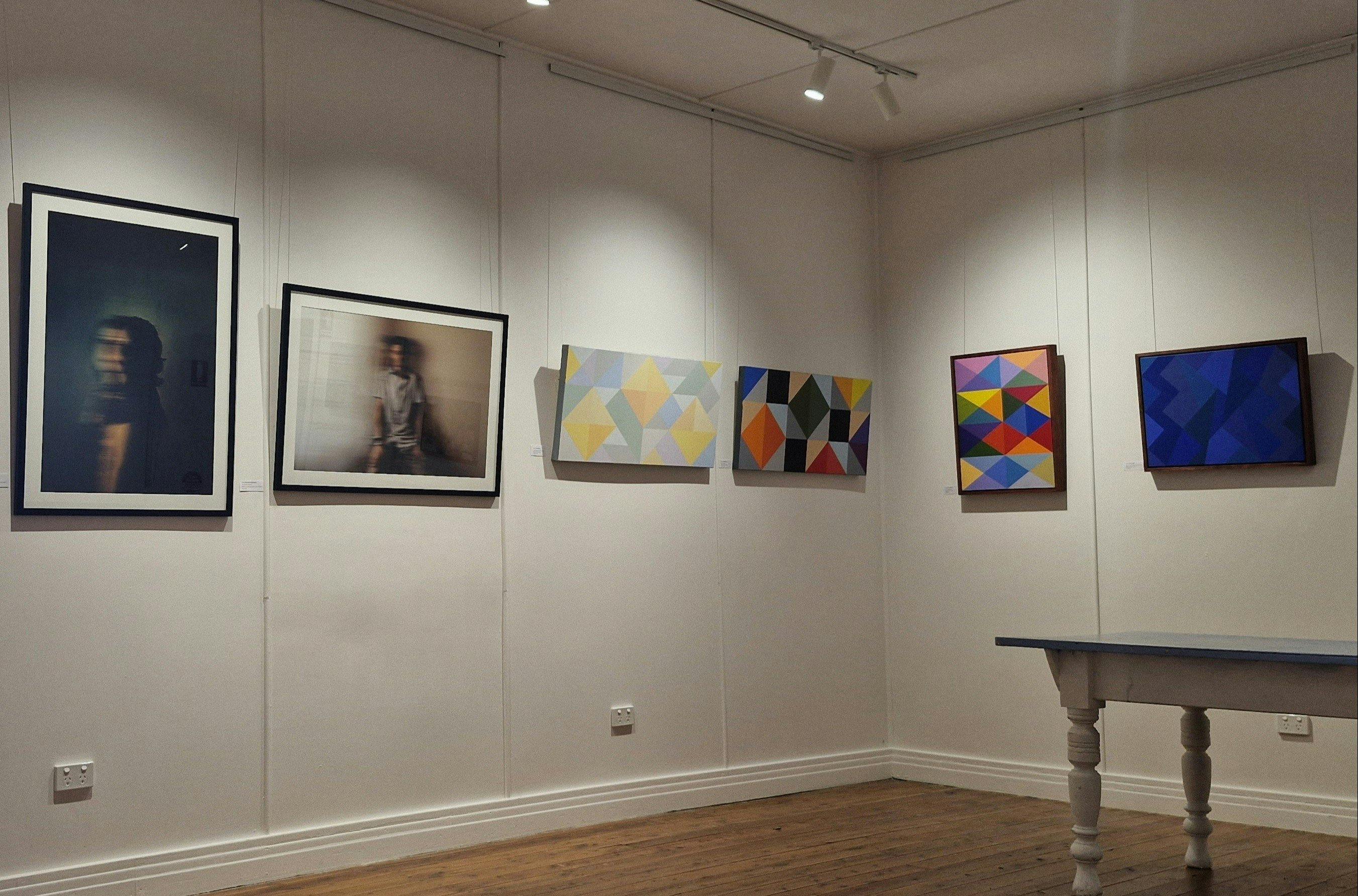 Exhibtion of Abstract paintings by John Barnes and Photography by Benjamin Broinowski in gallery.