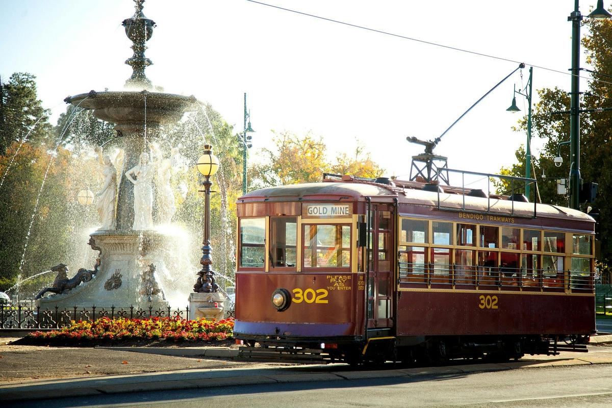 Vintage Talking Tram passing Alexandra Fountain