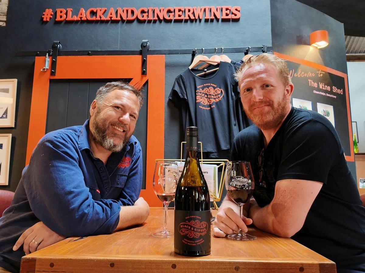 Hadyn Black & Darcy enjoying a glass of wine at the shed