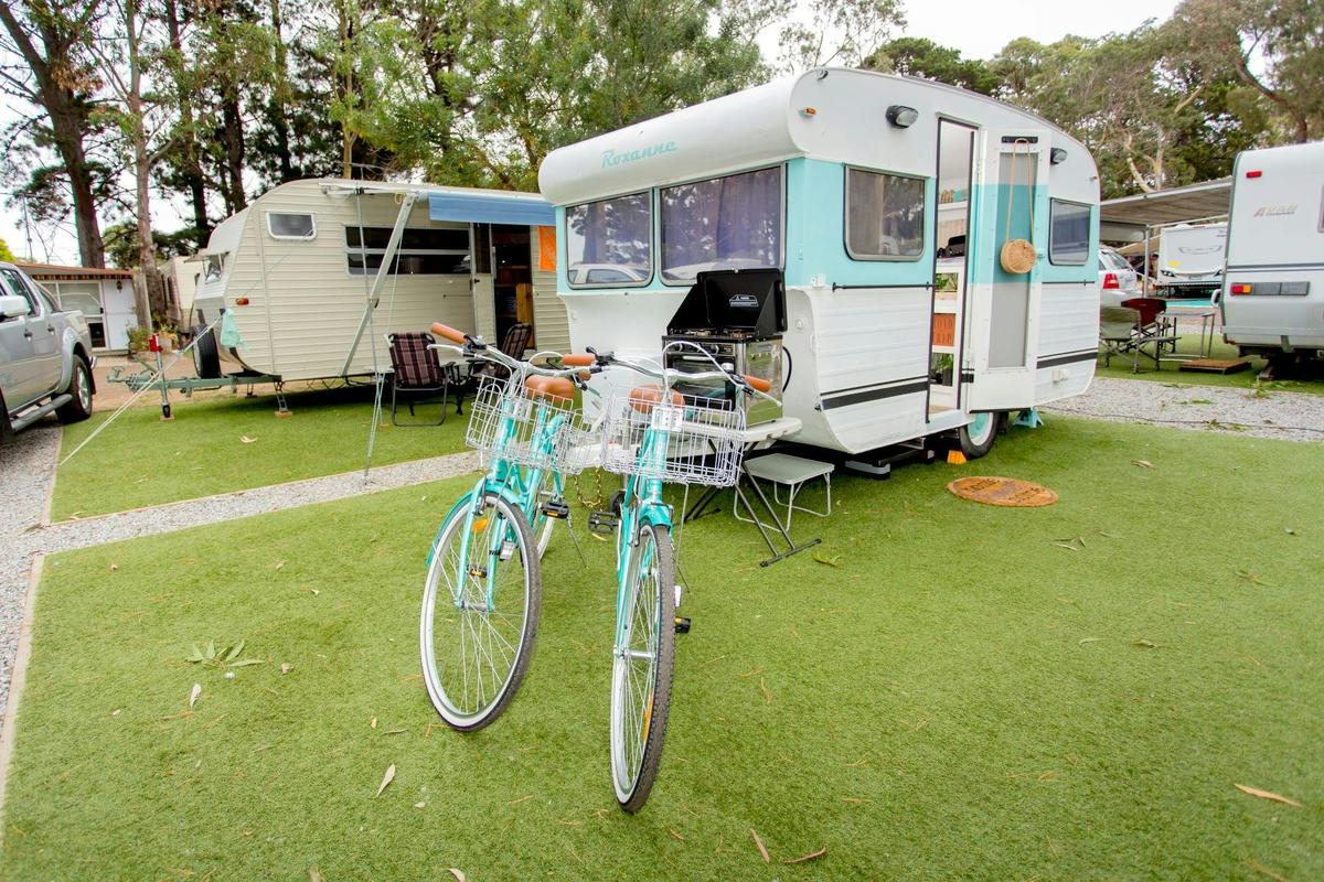 Powered site with caravan