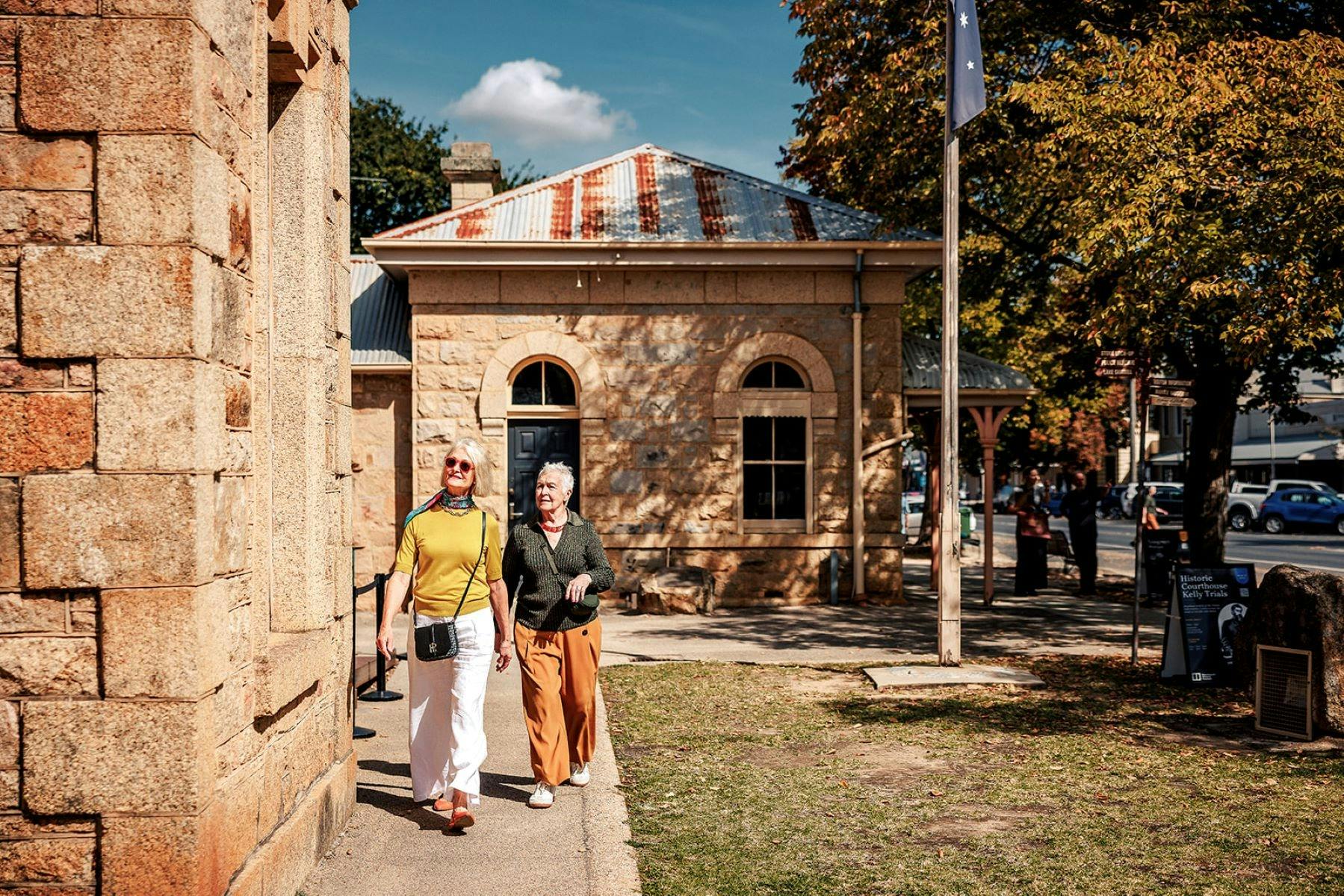 Two women admiring the Beechworth Courthouse building