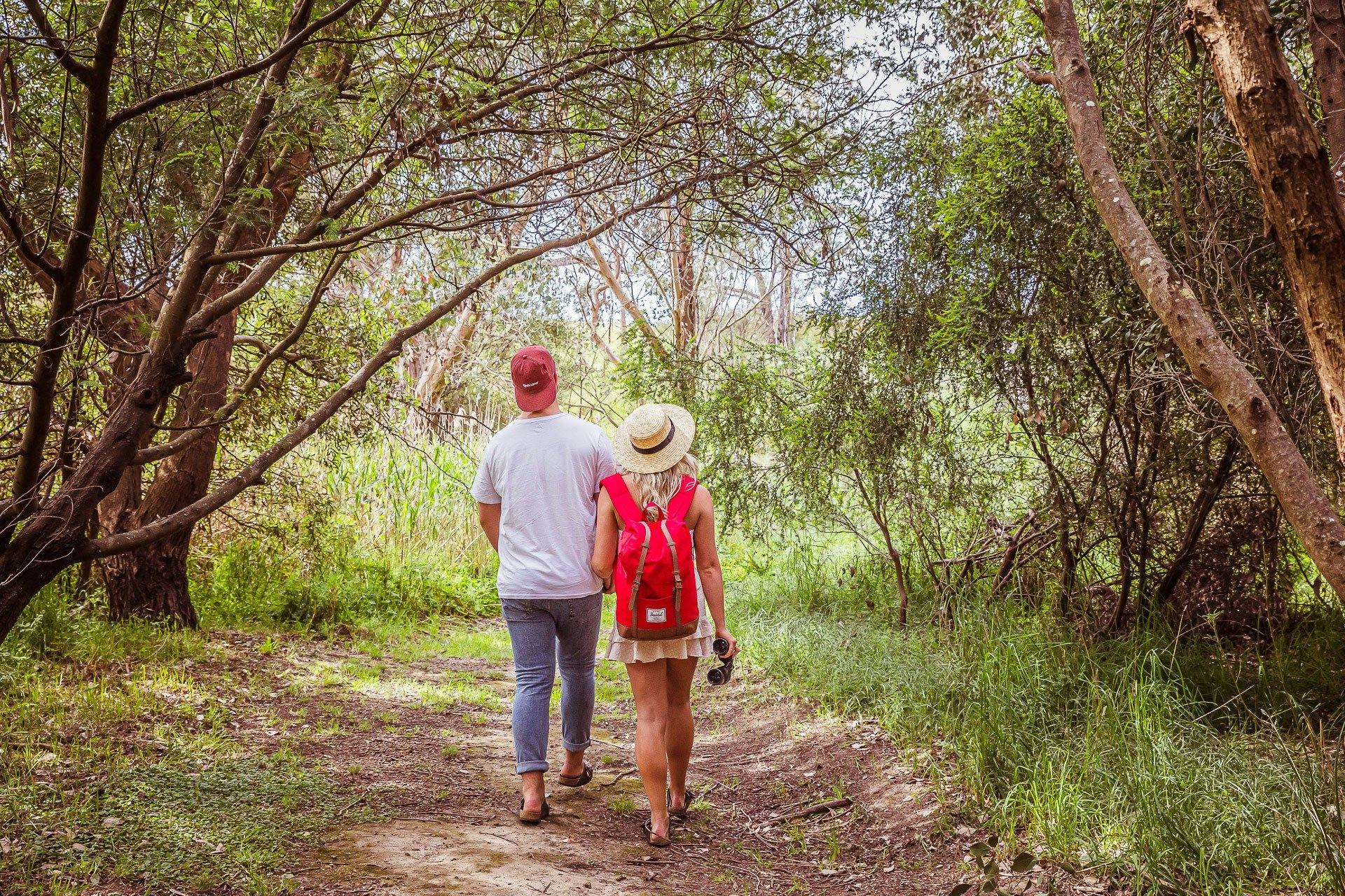 Couple walking down trail