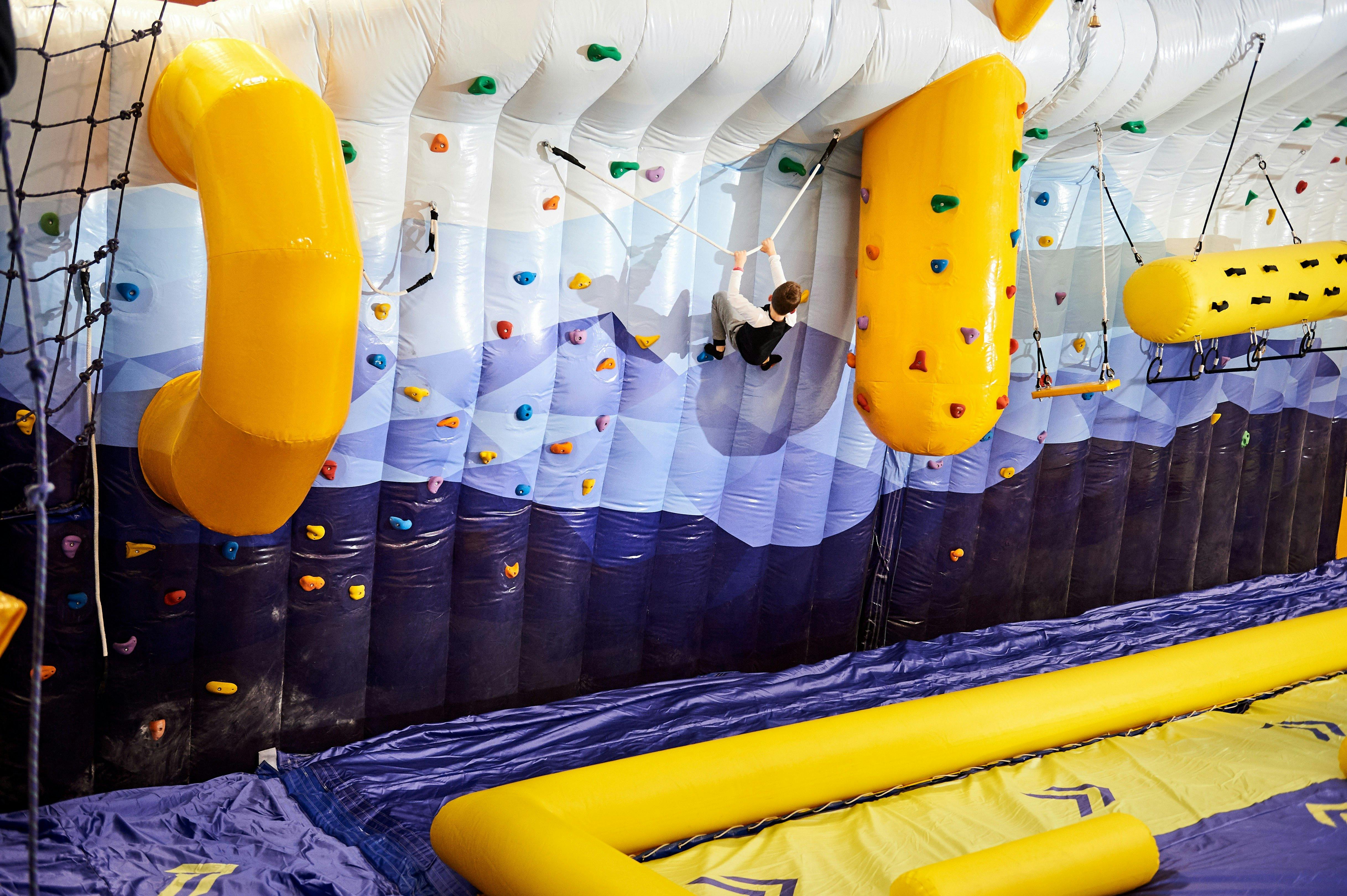 Tackling the inflatable climbing wall at Buller Air Zone