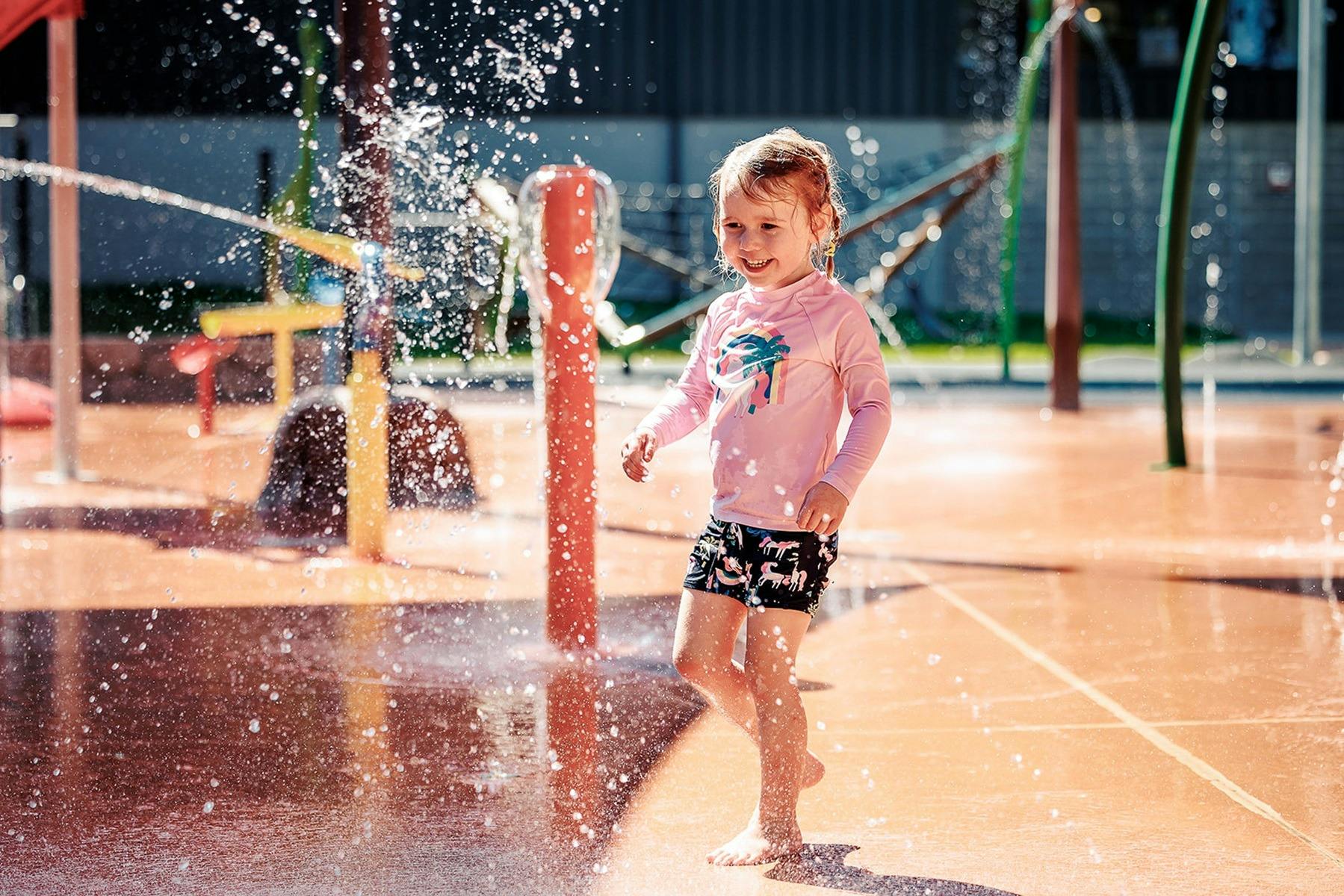 Little girl playing at the Benalla Splash Park