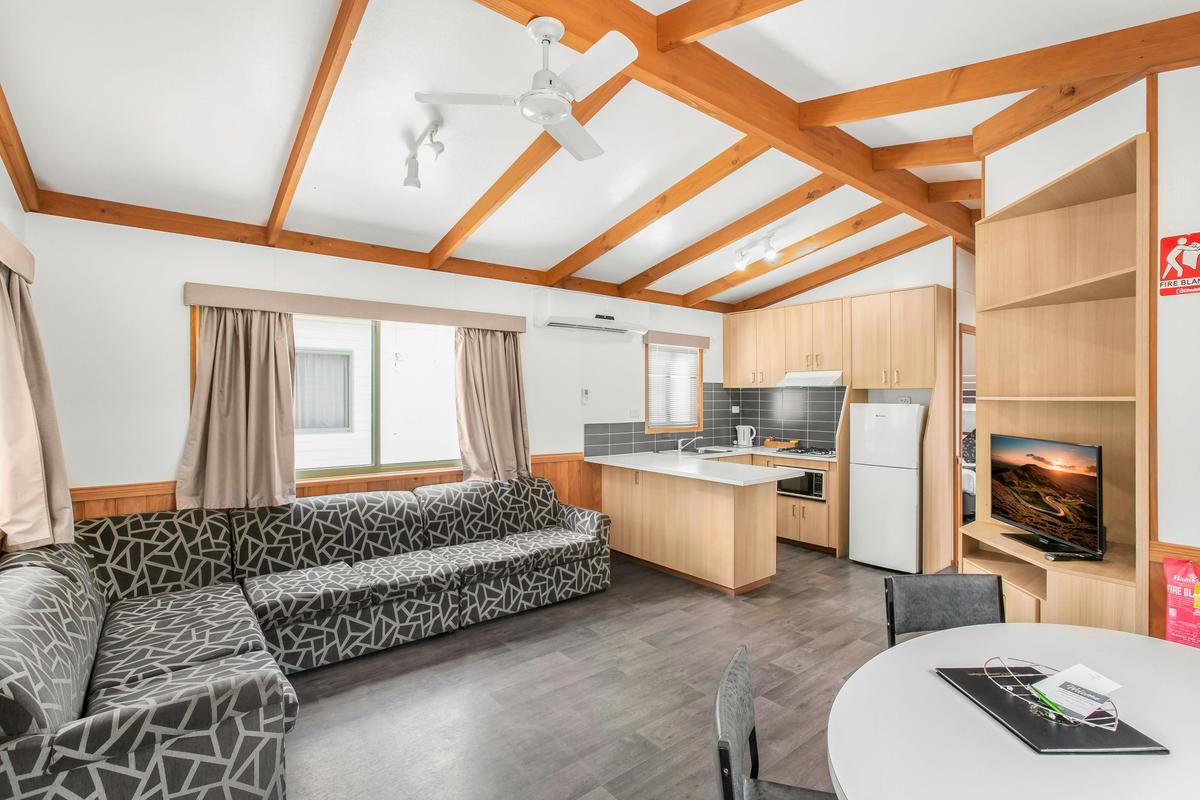 Living area and kitchen in the two-bedroom deluxe cabin