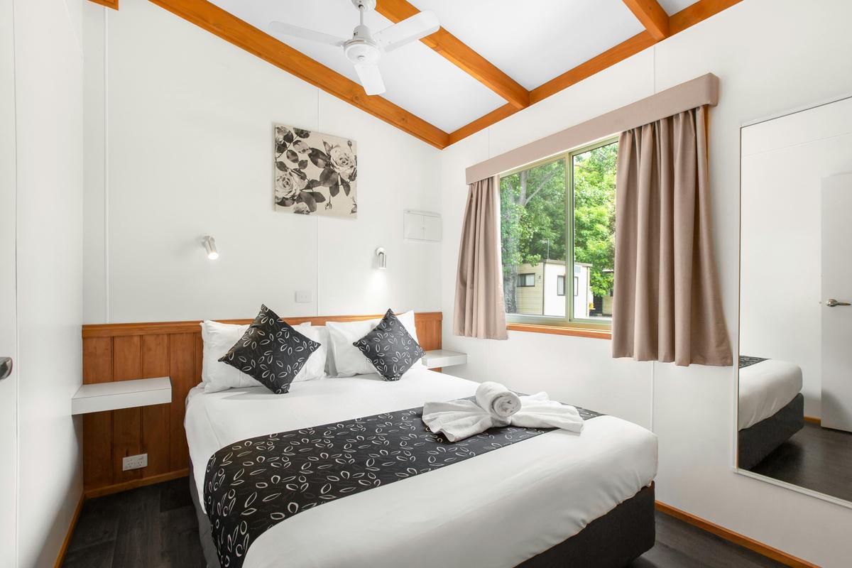 Queen bed in the two-bedroom deluxe cabin