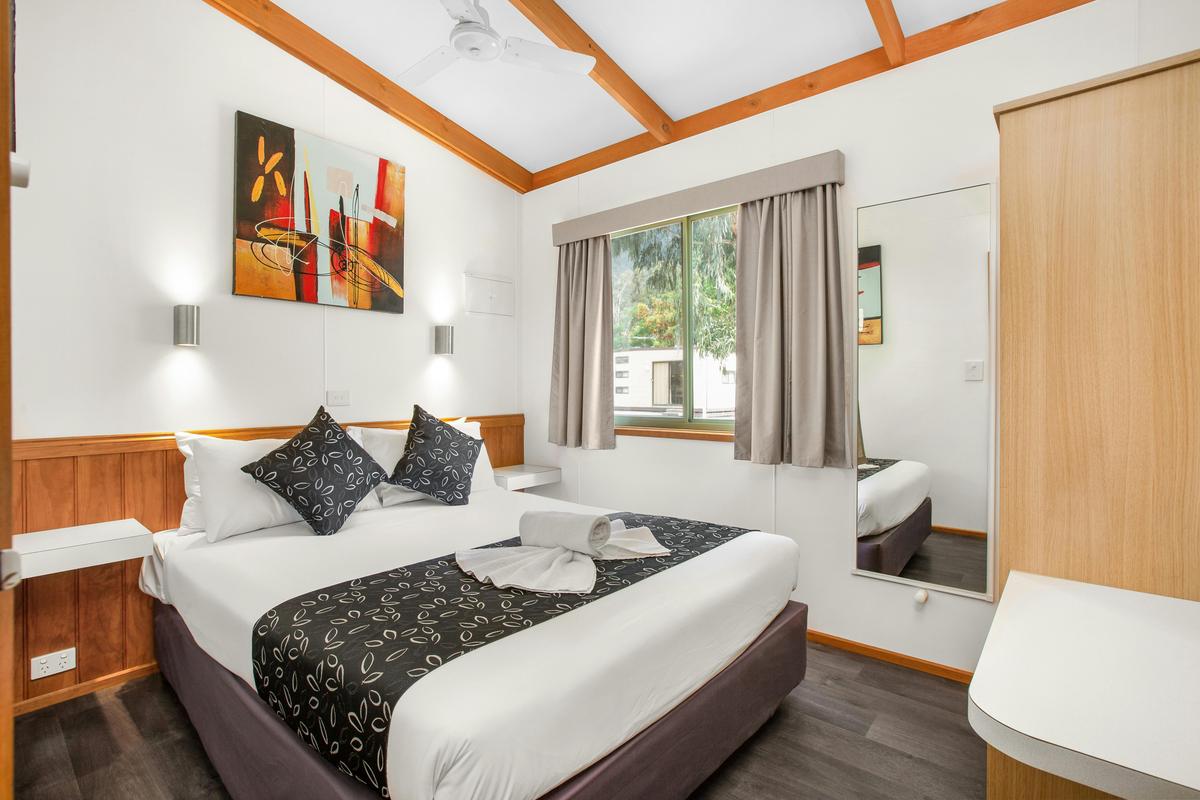 Main bedroom with a queen bed in the Three-Bedroom Deluxe Cabin