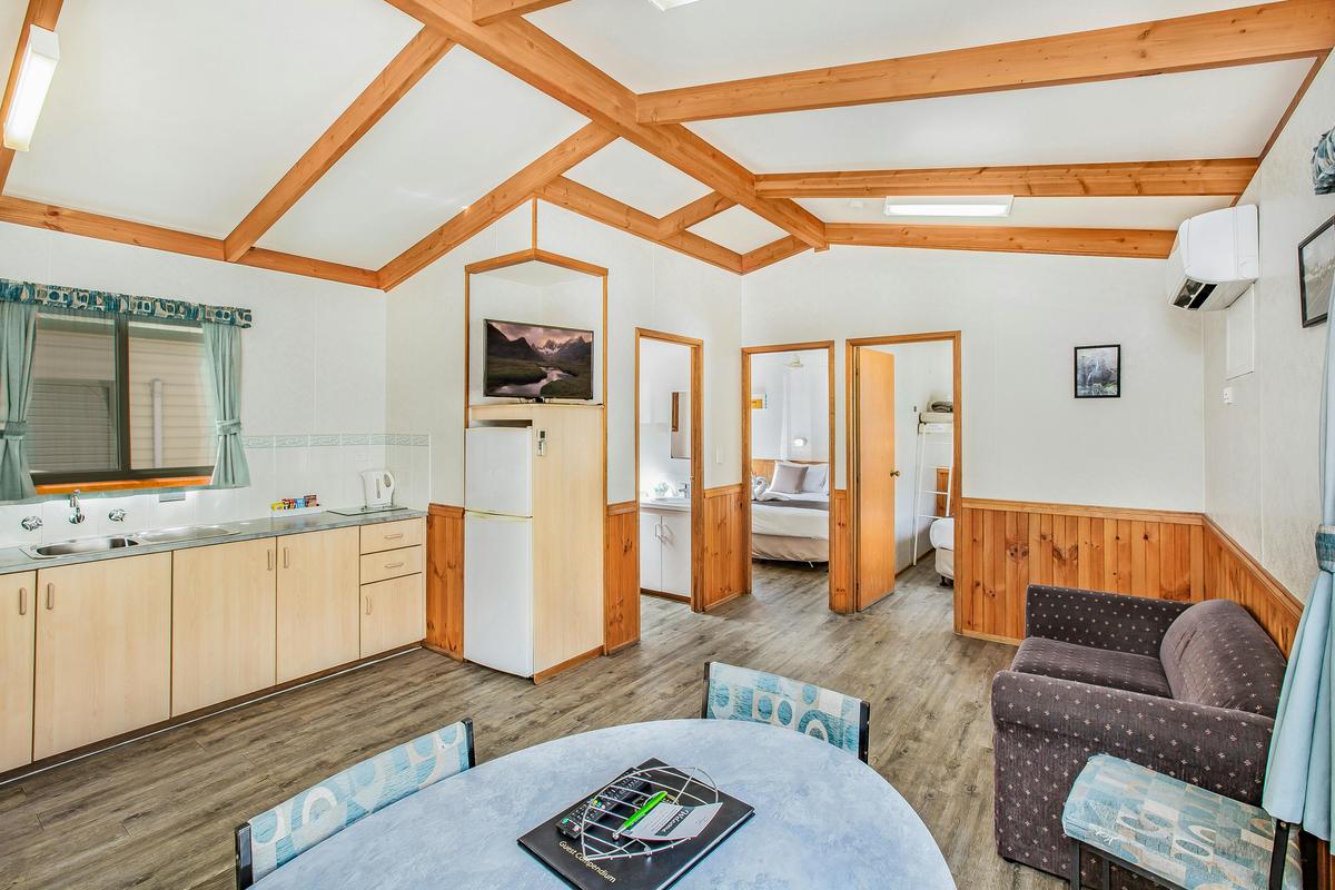 Kitchen and living area in the Two-Bedroom Budget Cabin
