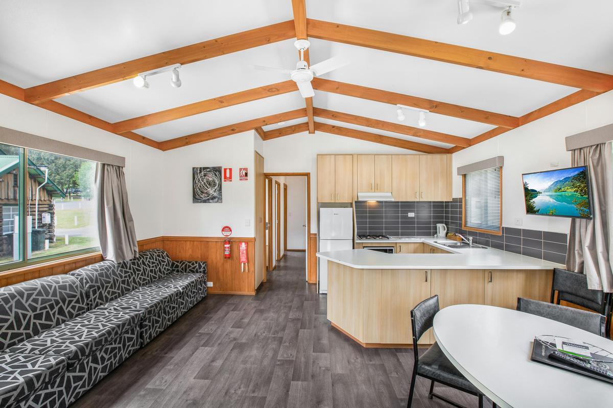 Kitchen and living area in the Three-Bedroom Deluxe Cabin