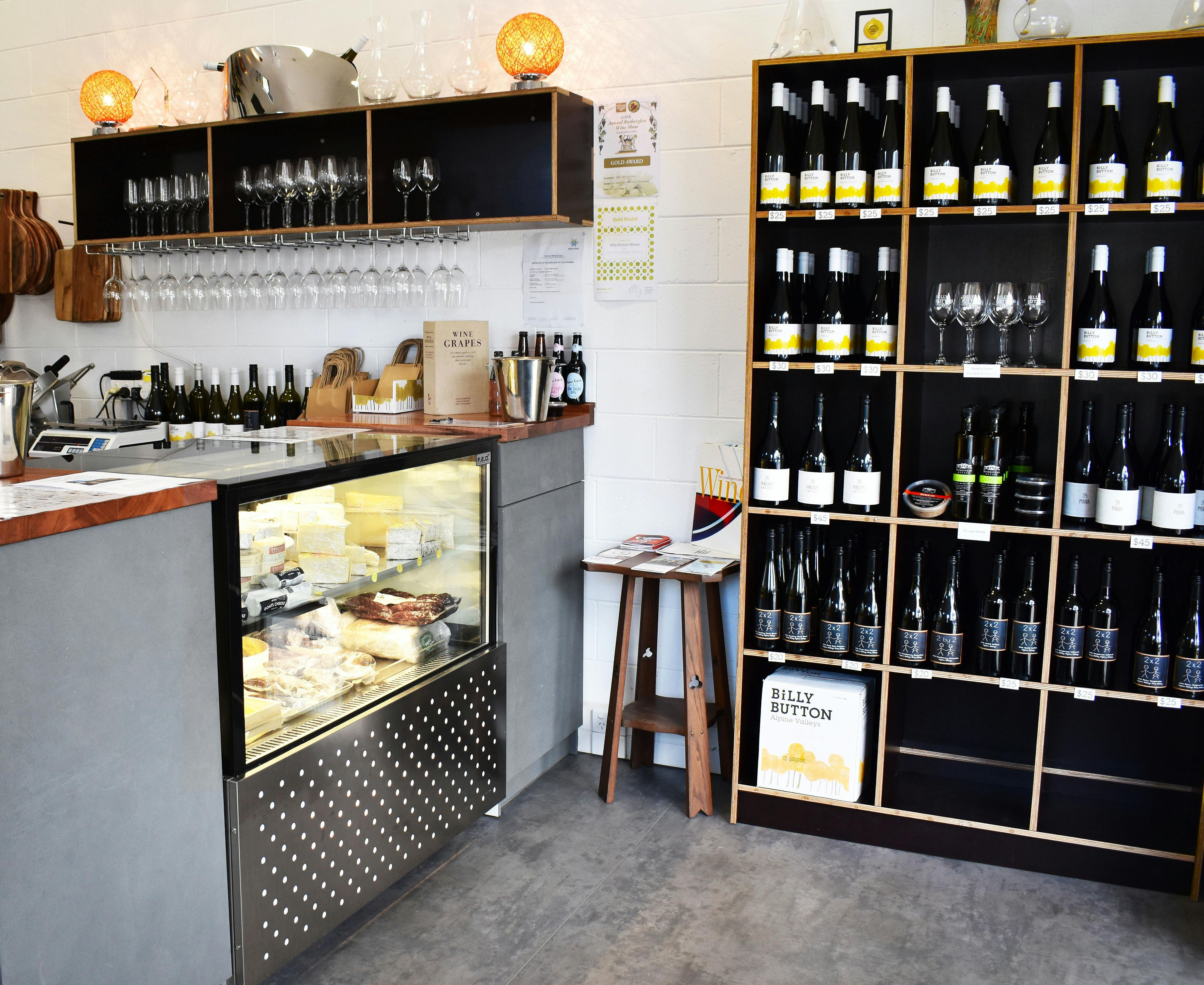 The front cheese counter and wine shelves inside Billy Button's Bright cellar door