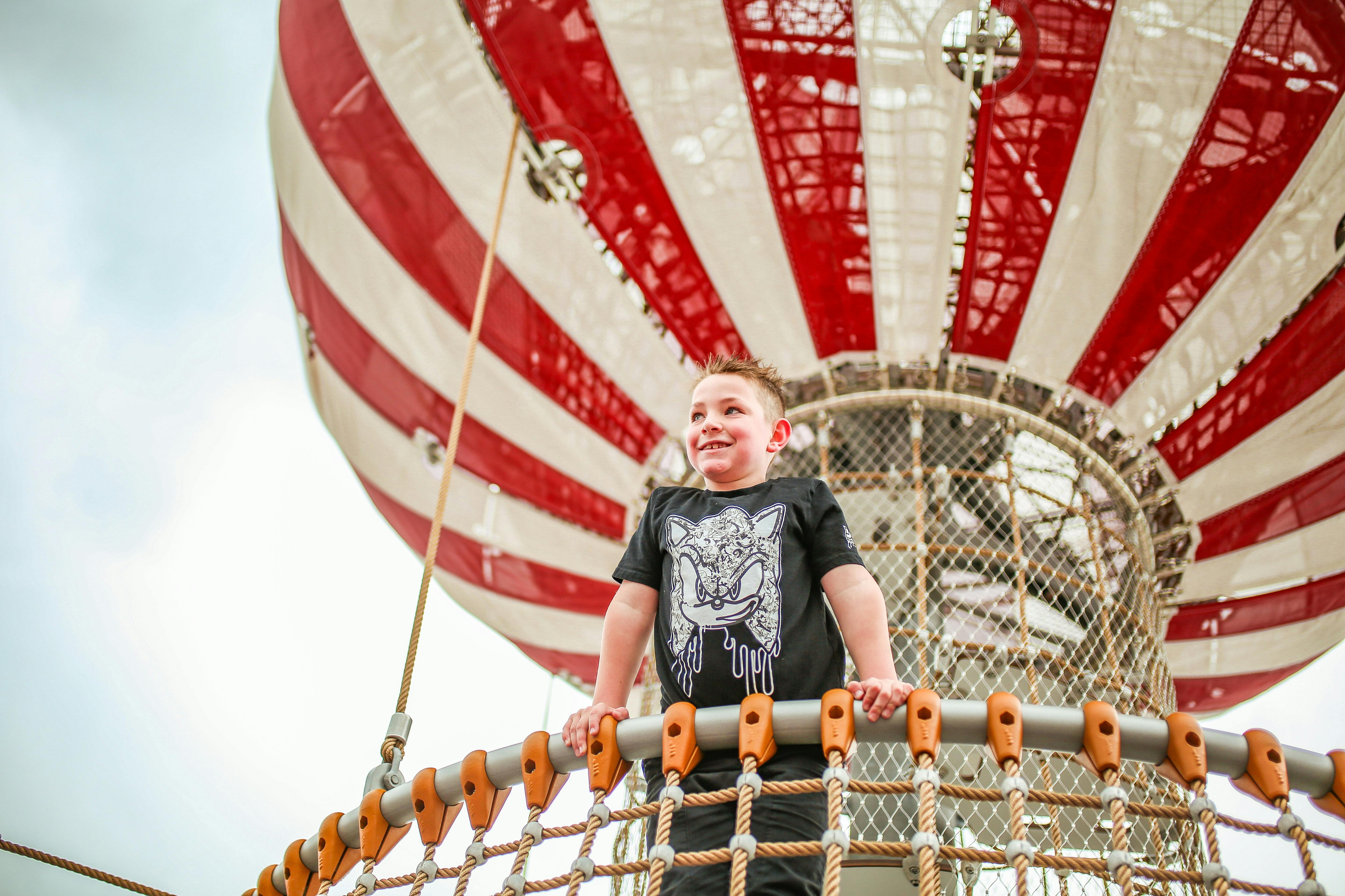 Child climbing the balloons