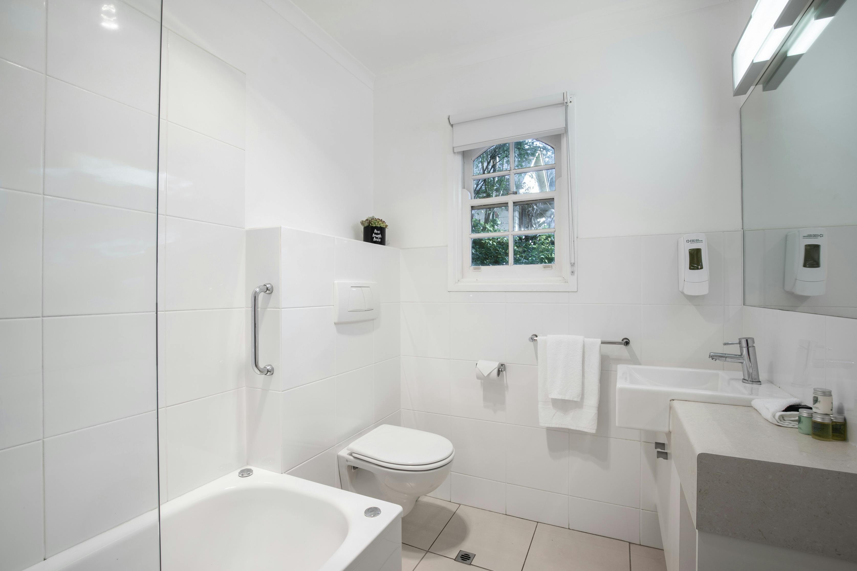 bathroom with bath and toilet